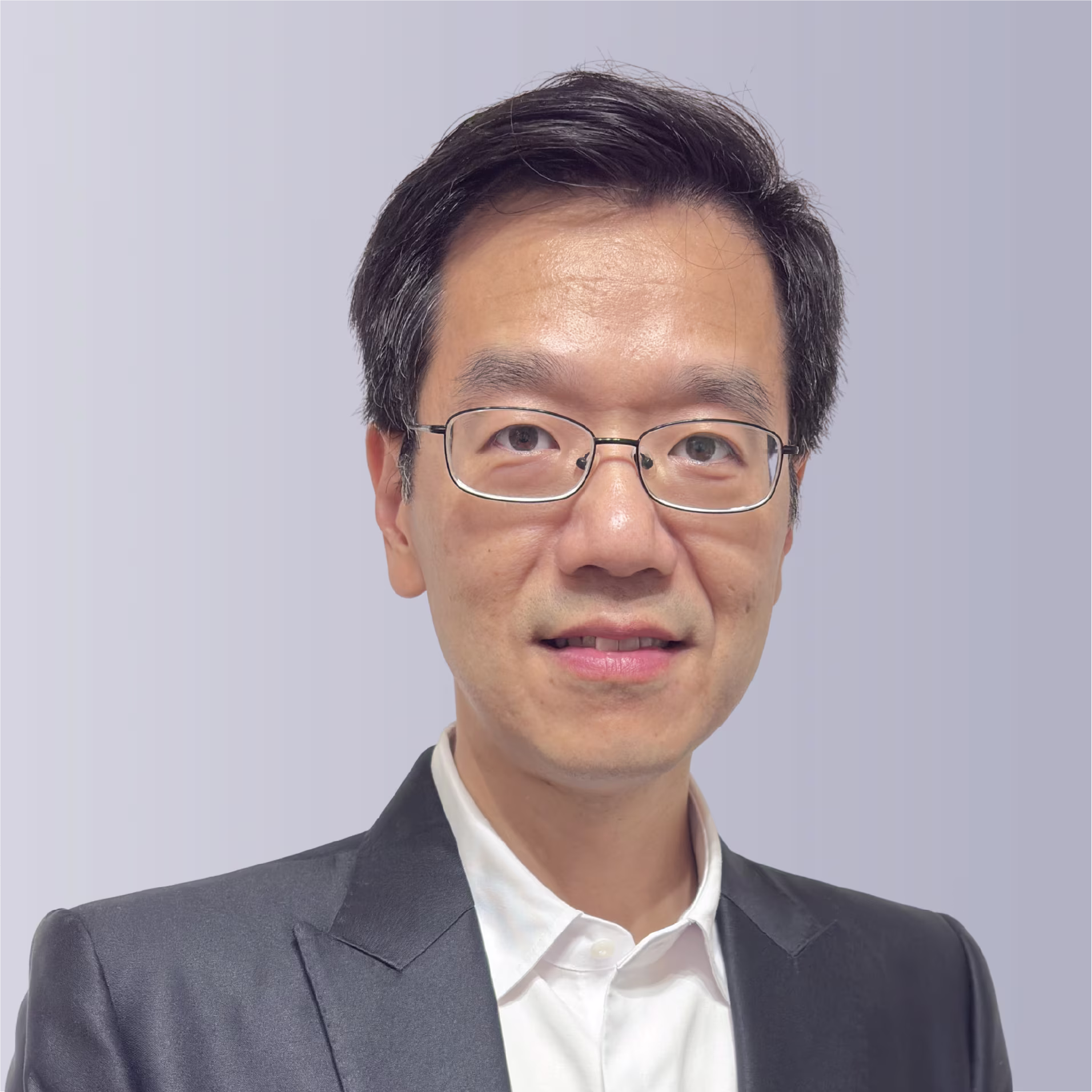 Two professionals shaking hands outdoors, symbolizing partnership and collaboration.