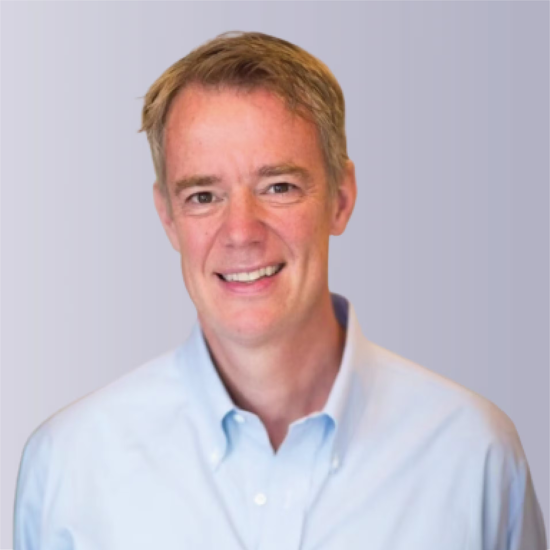 Two professionals shaking hands outdoors, symbolizing partnership and collaboration.