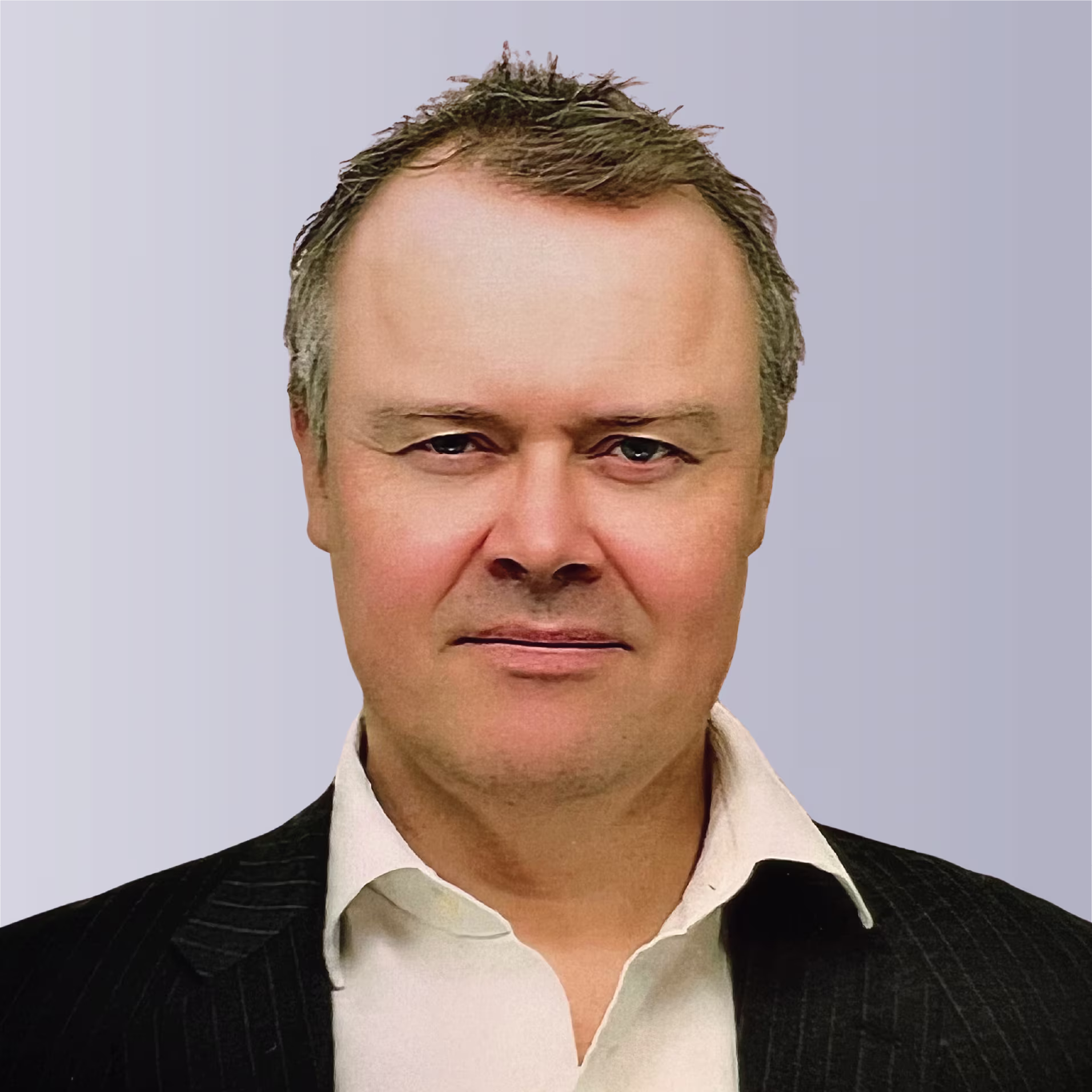 Two professionals shaking hands outdoors, symbolizing partnership and collaboration.