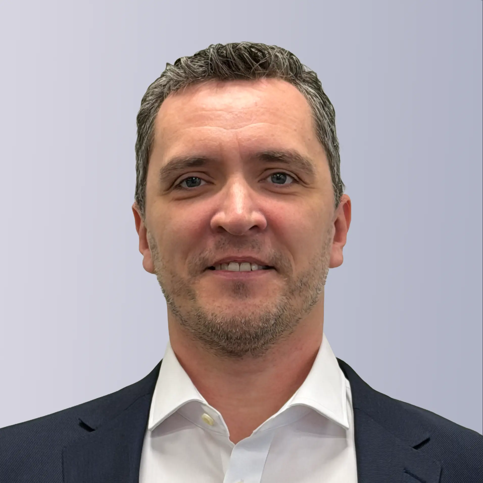 Two professionals shaking hands outdoors, symbolizing partnership and collaboration.