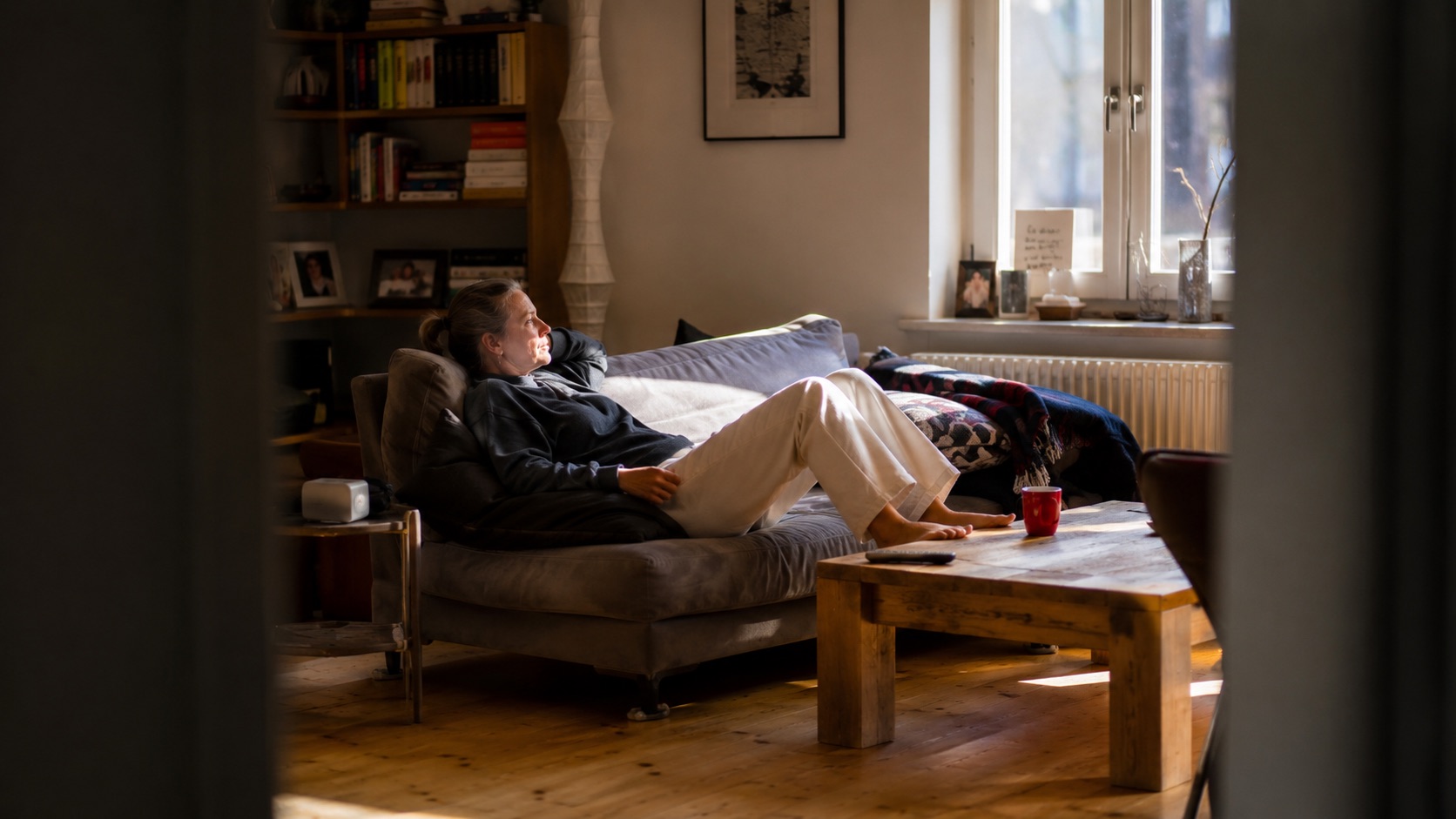 A woman sitting on a couch relaxing