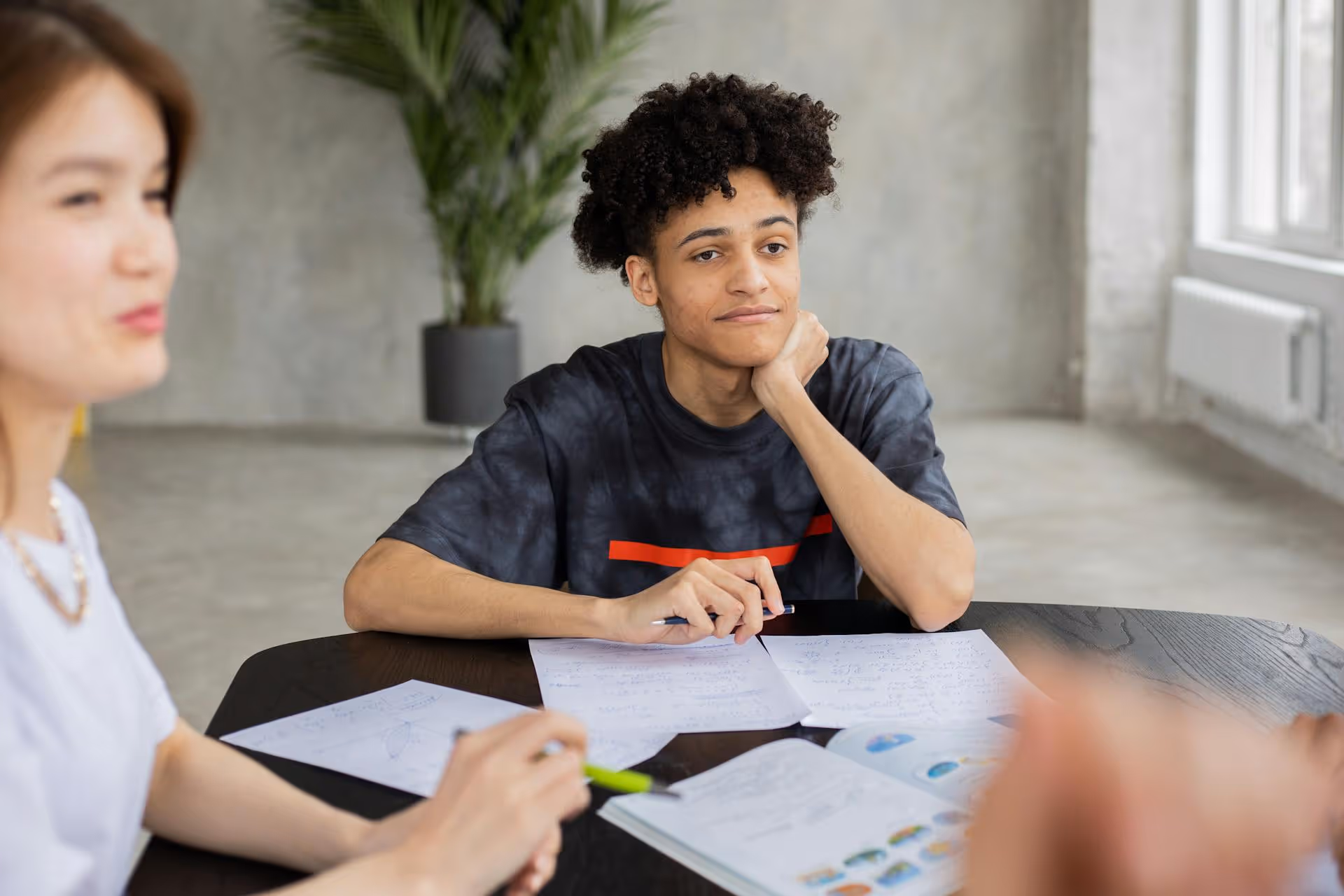 High school student learning with a tutor