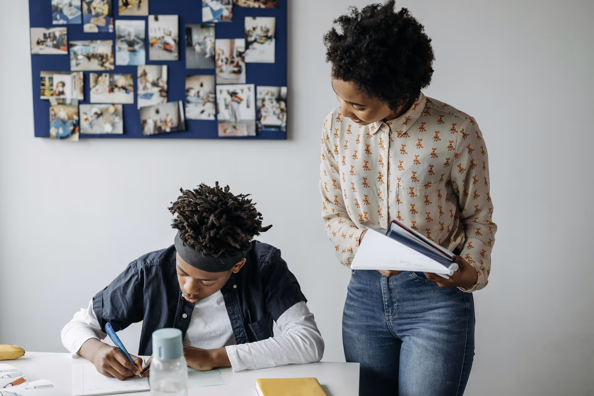 High school student learning with a tutor