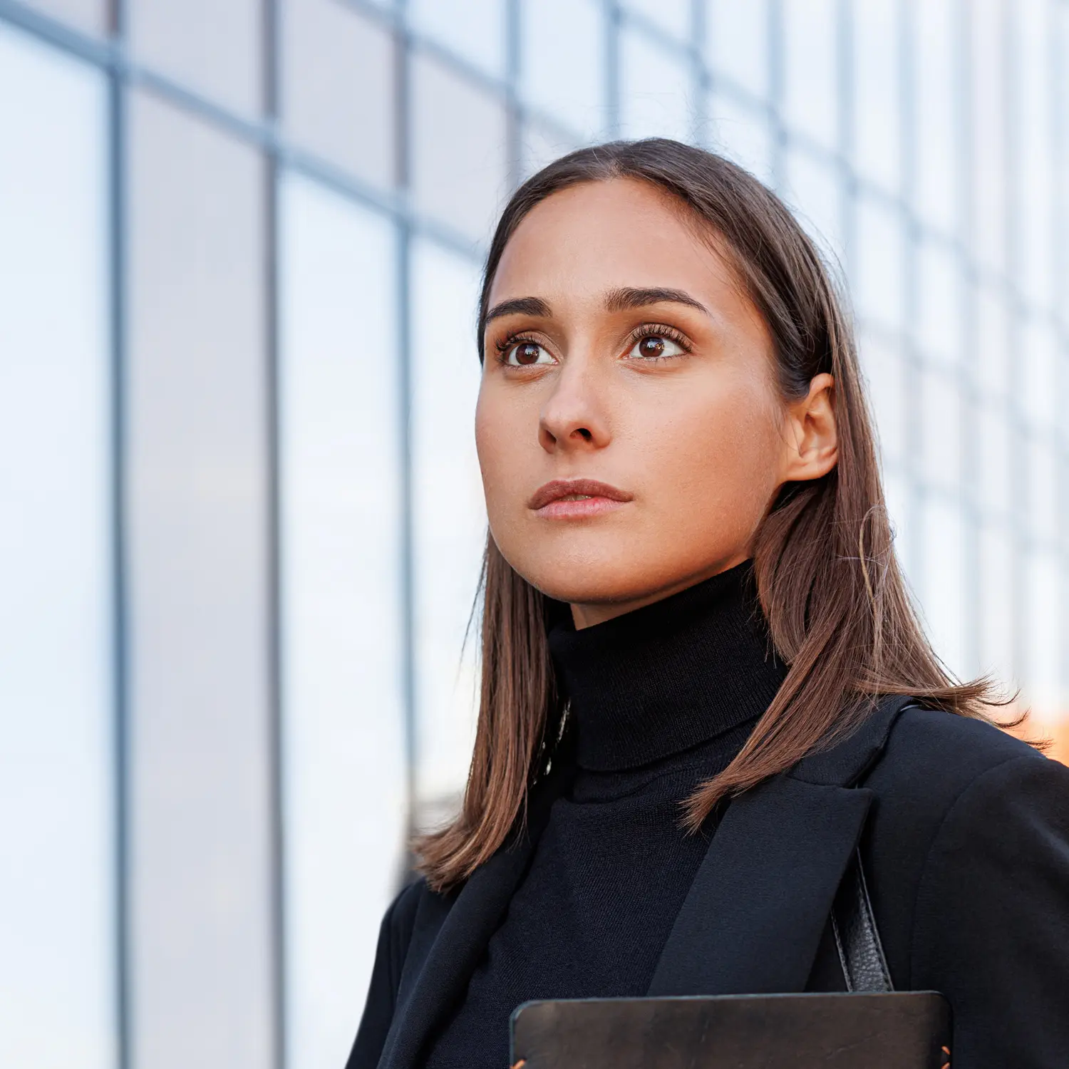 A young woman looking into the distance.