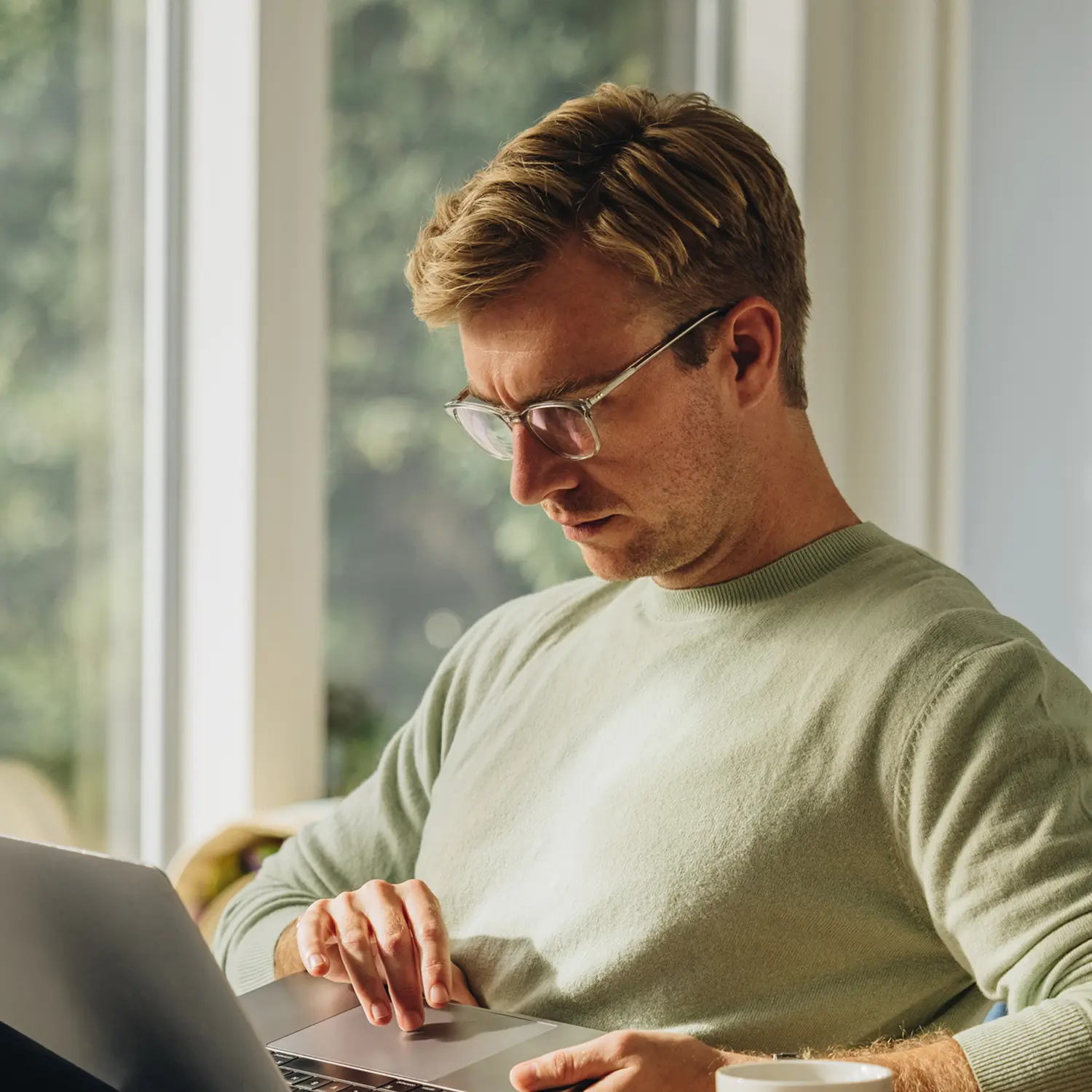 A man looking at a laptop.