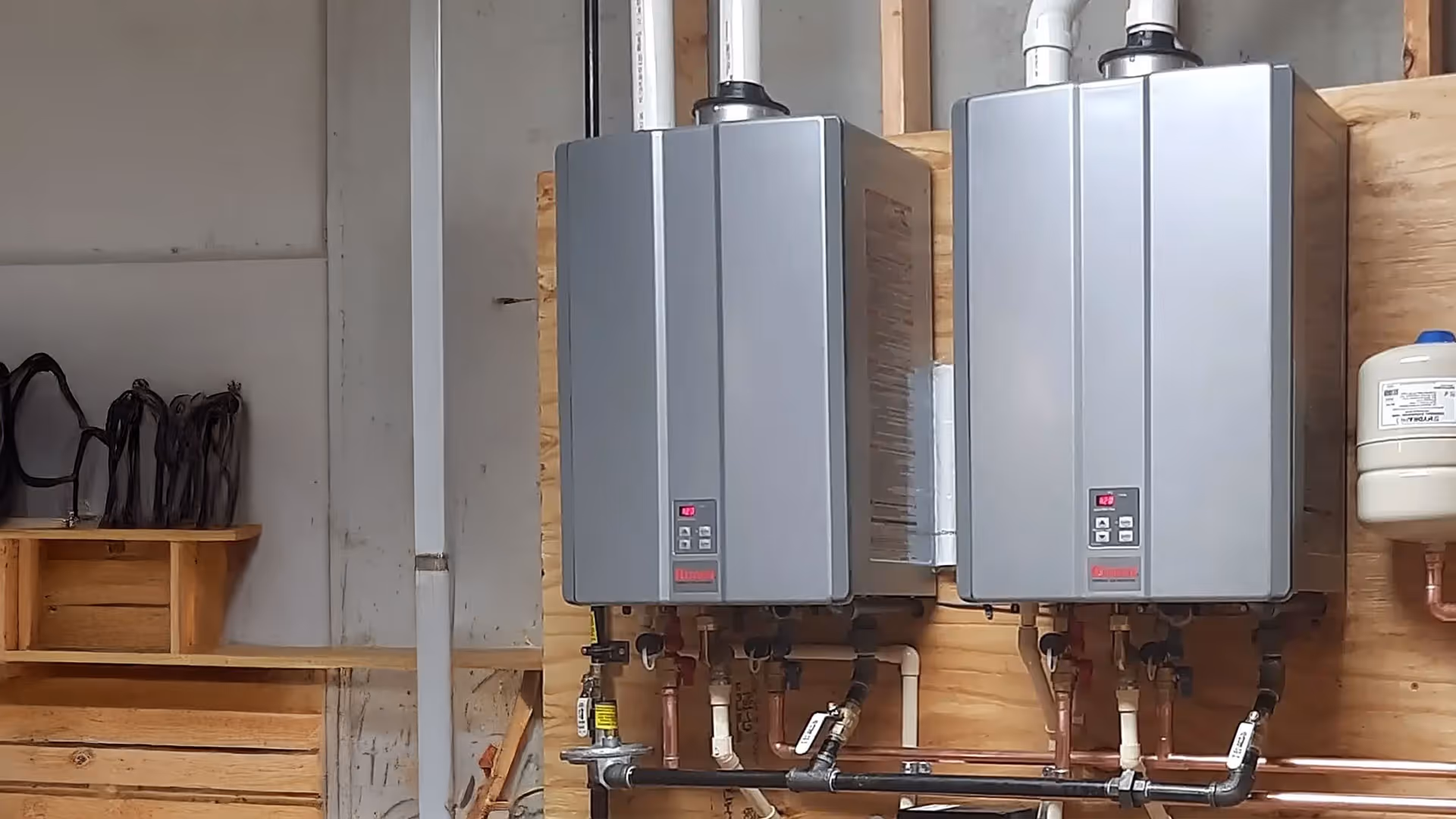 High-efficiency tankless water heaters installed by Minuteman Plumbing, Heating & Cooling, providing energy-saving hot water solutions for homes in Greater Boston and the South Shore.