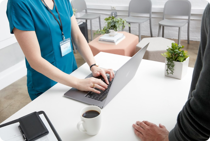 Small business owner typing on a keyboard in a veterinarian's office