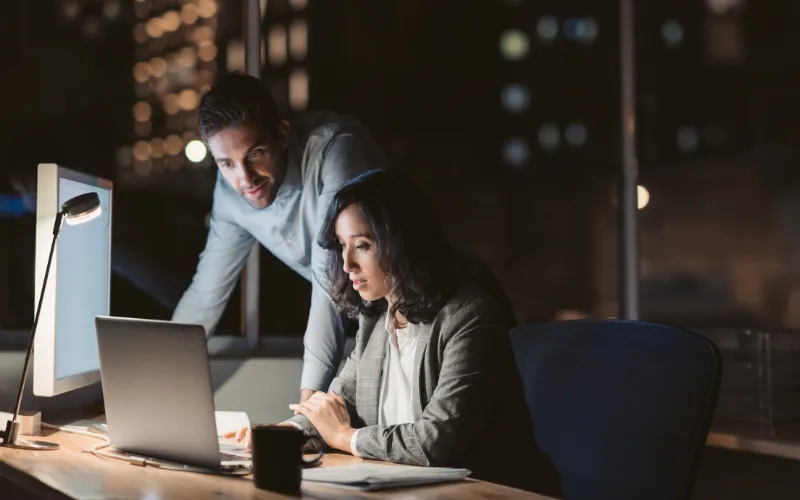 Two people working late on a project