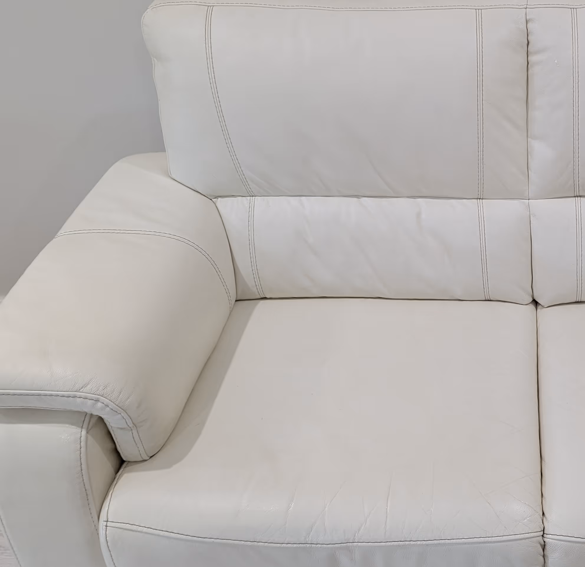 White leather couch after cleaning, looking fresh and restored.