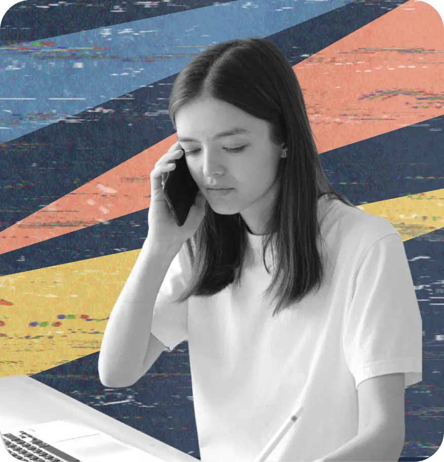 Young woman talking on the phone while writing in a notebook, seated at a laptop. Abstract colorful background with diagonal paint strokes in blue, orange, and yellow.