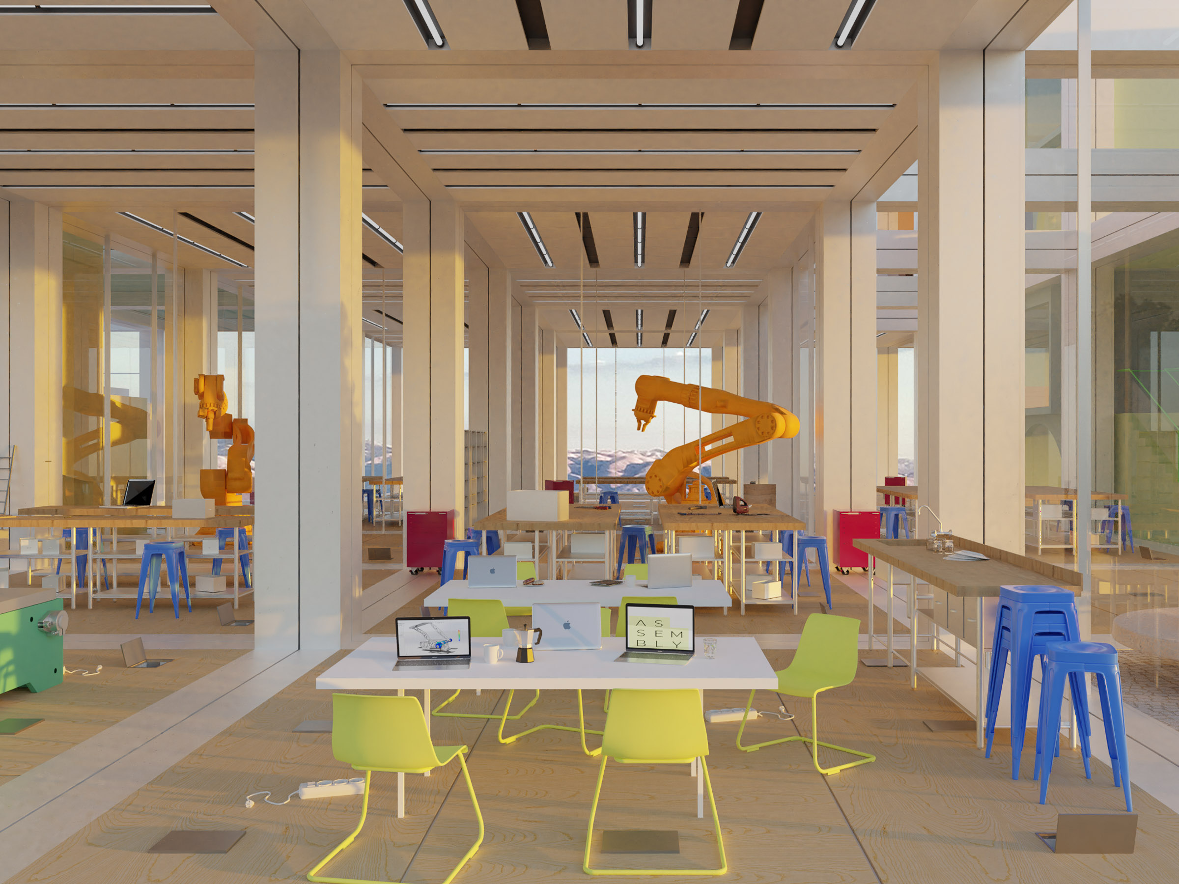 interior maker space with fabrication equipment and communal work areas arranged beneath the modular ceiling grid