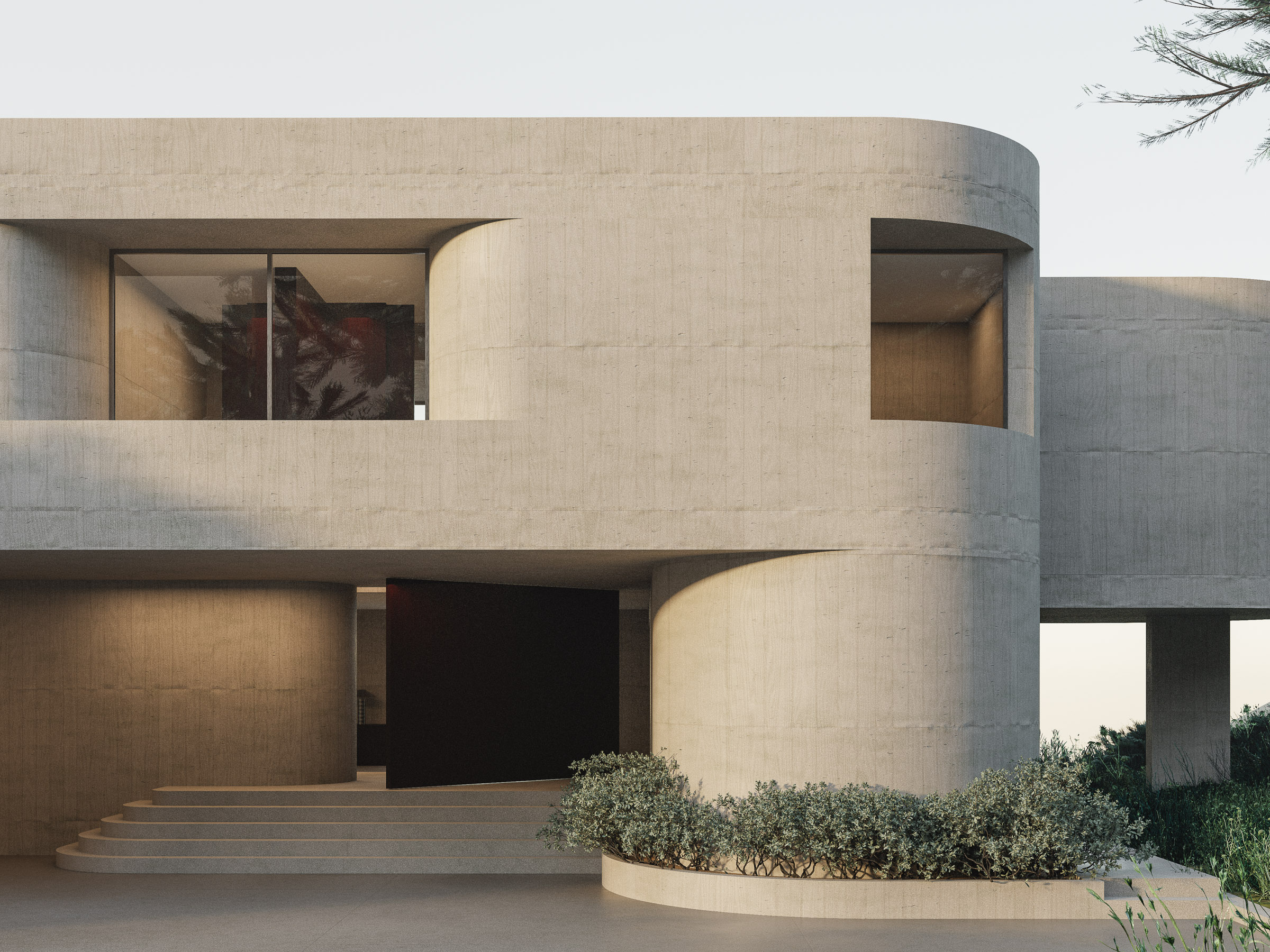 A view through pine trees reveals the residence embedded in the terrain, with terraces and framed openings following the slope.