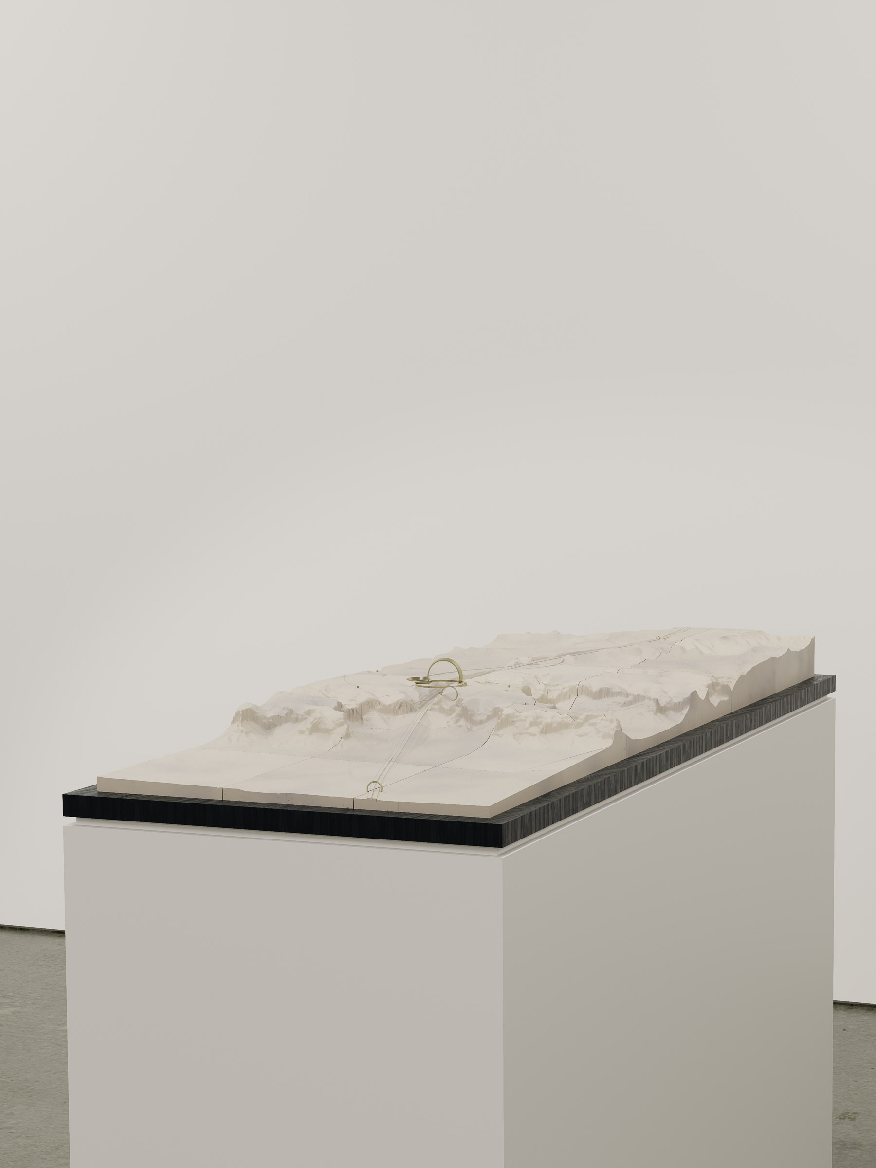 Site-wide view of the physical model placed on plinth, illustrating the project's conceptual clarity and spatial resolution across desert terrain.