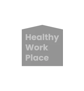 Gray badge or shield icon with white text reading "Healthy Work Place"