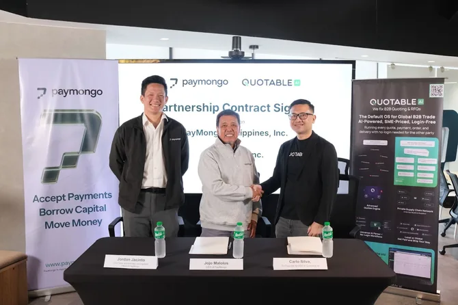 Three business professionals shake hands at partnership contract signing event between Paymongo and Quotable.