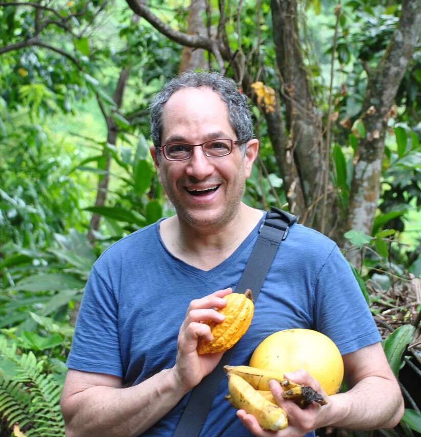 Image of Rich Tango-Lowy holding cacao pods