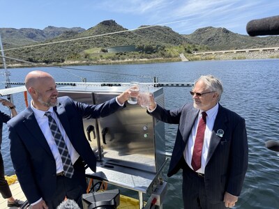 David Pedersen from LVMWD and Robert Bergstrom from OceanWell drink water produced by the pilot.