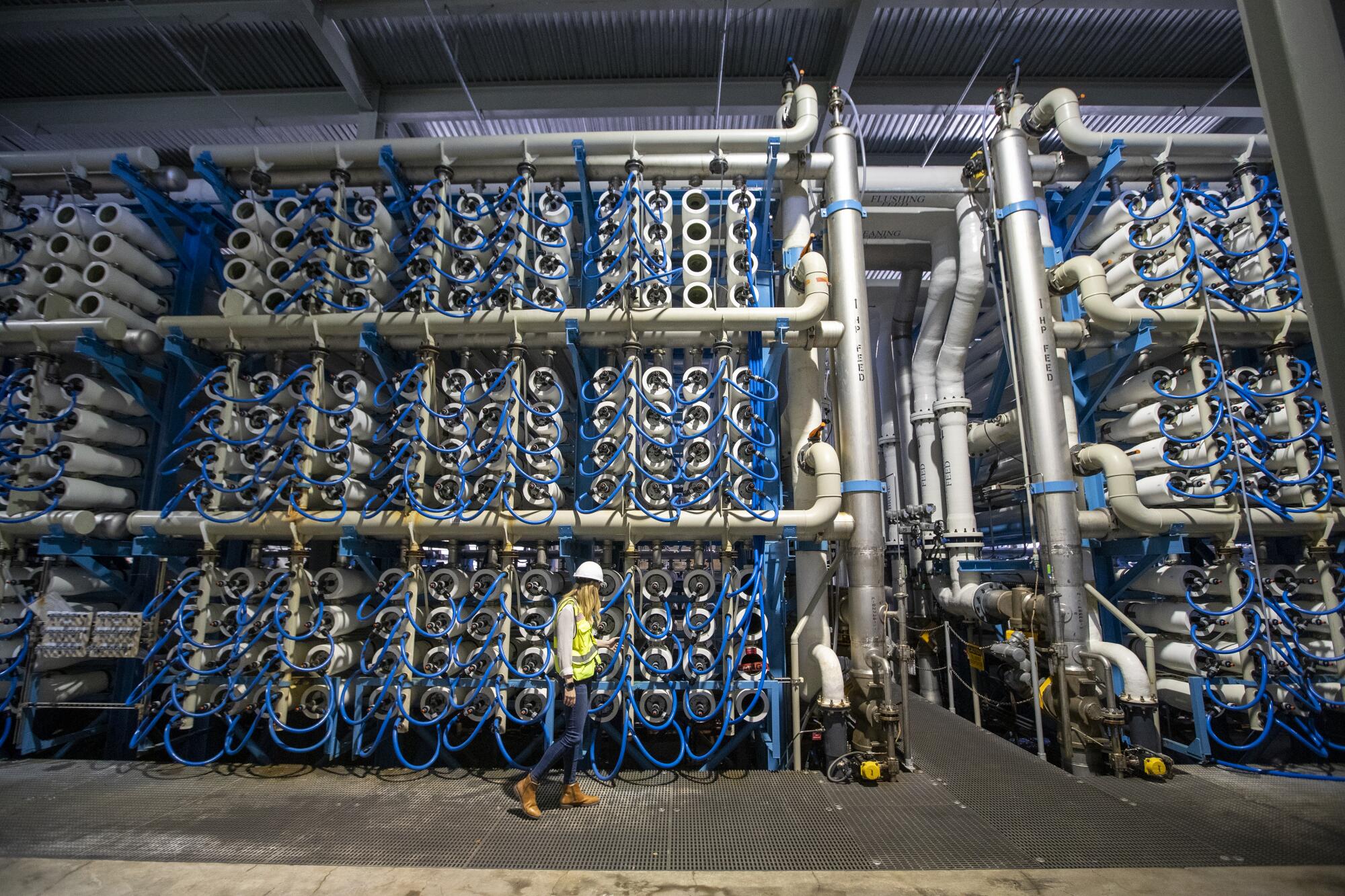 A worker at the Claude "Bud" Lewis Carlsbad Desalination Plant in Carlsbad.