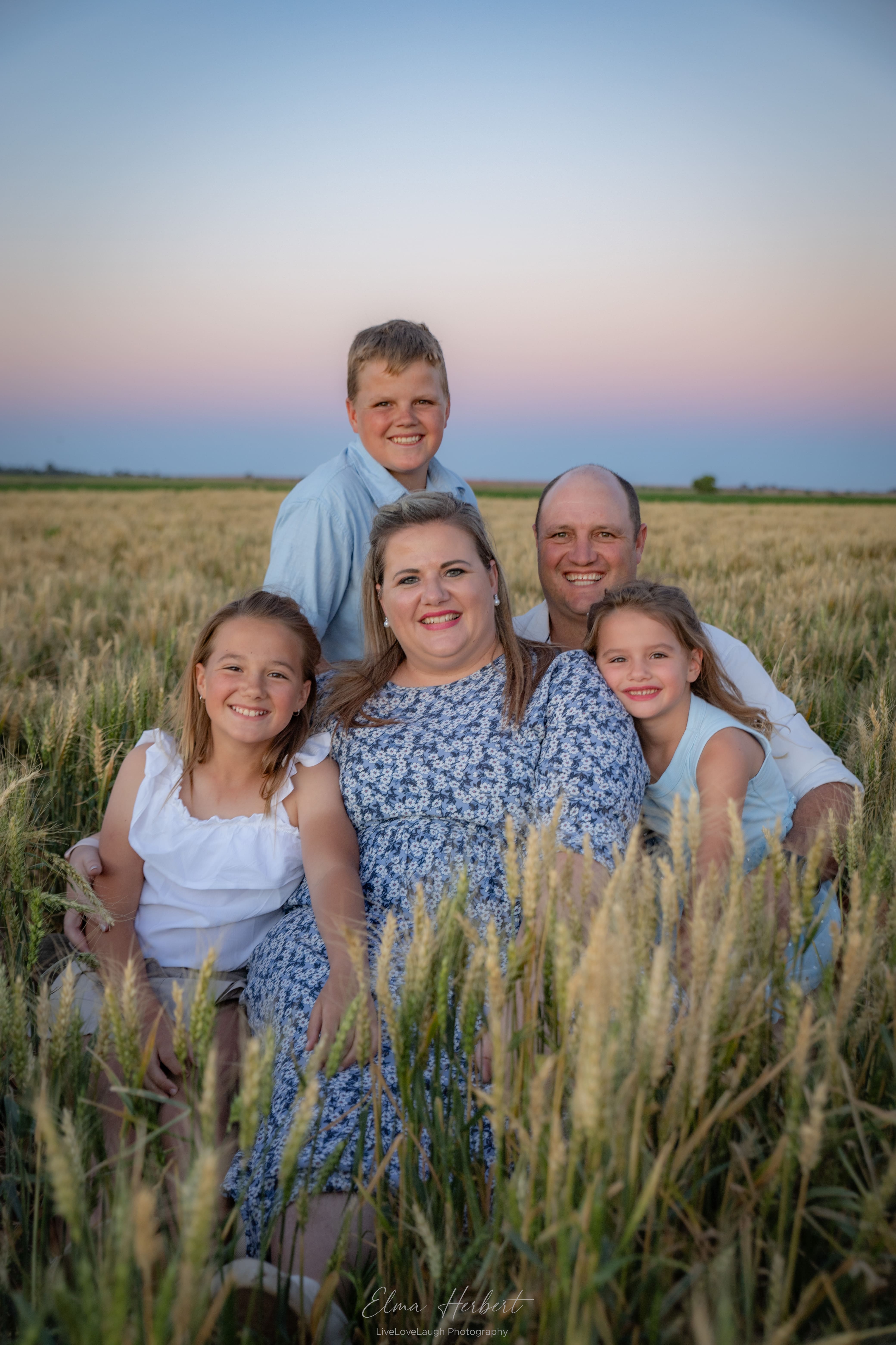 family shoot in a wheat field