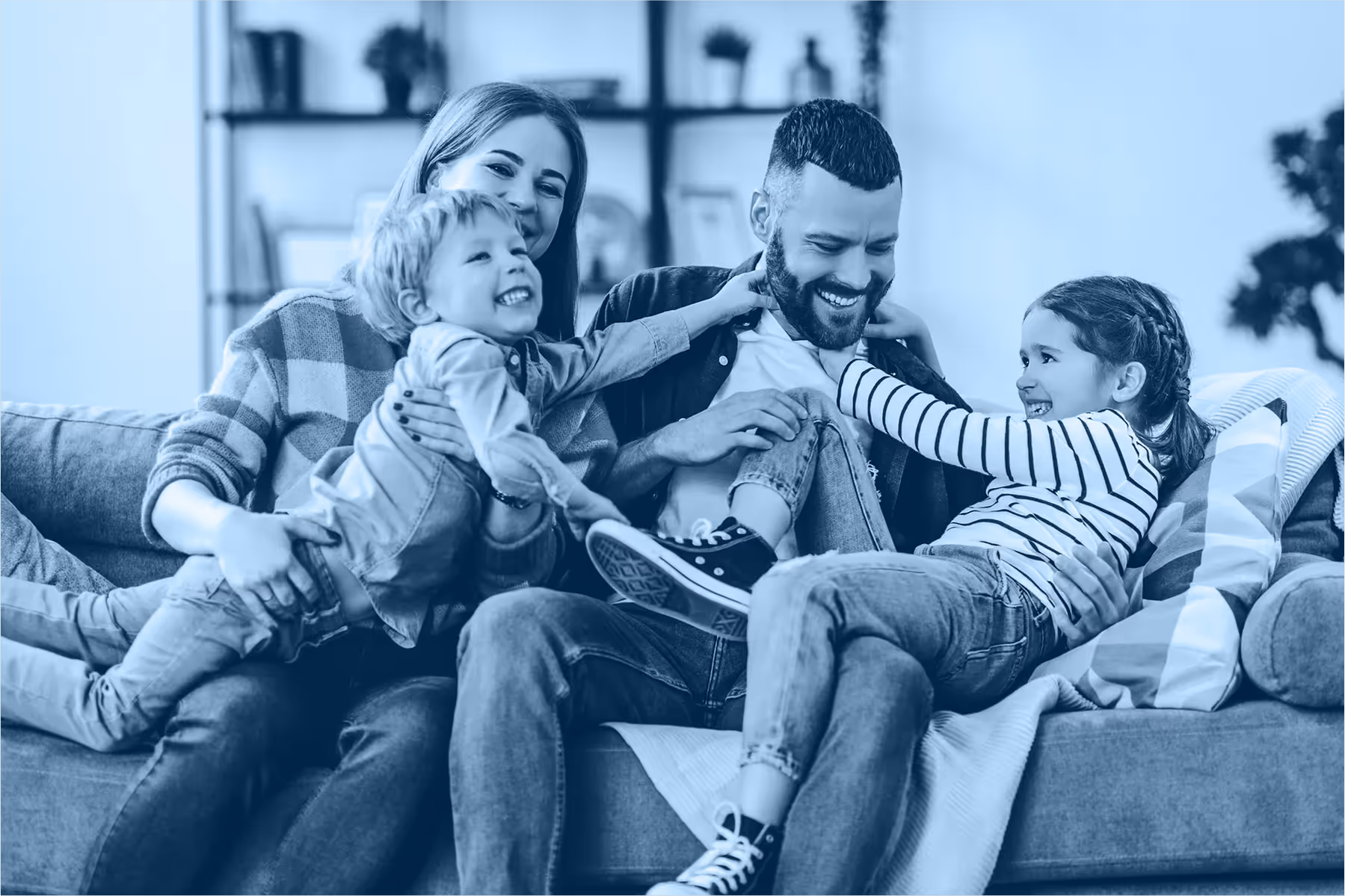 Man with family on couch