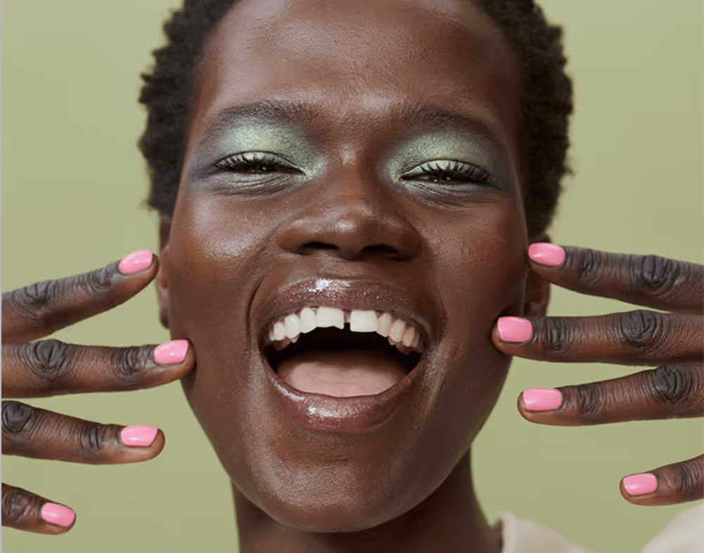 Smiling woman green eyeshadow