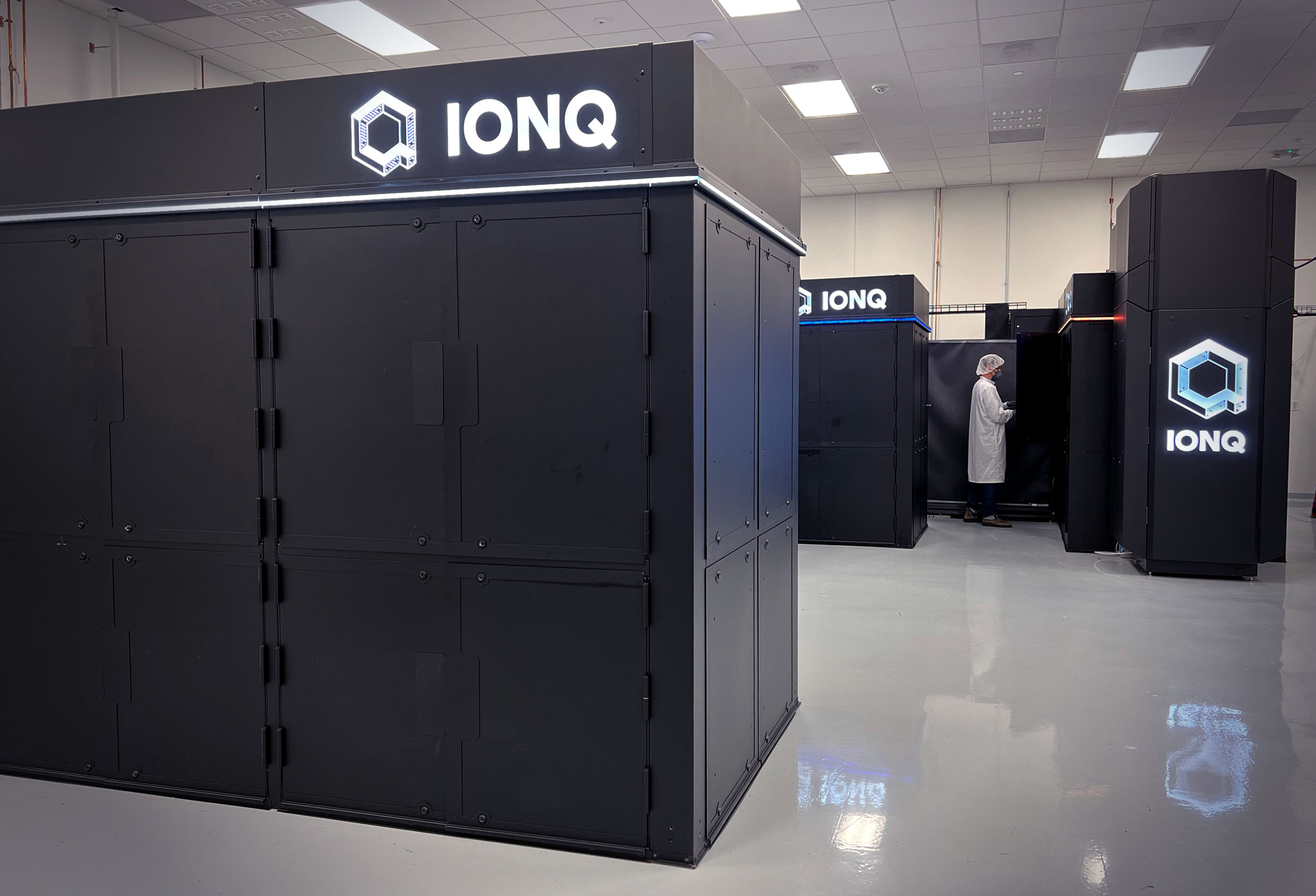 Fig. 1: Photograph of IonQ Forte (front left) in our quantum data center in College Park, MD. Copyright 2022 by IonQ