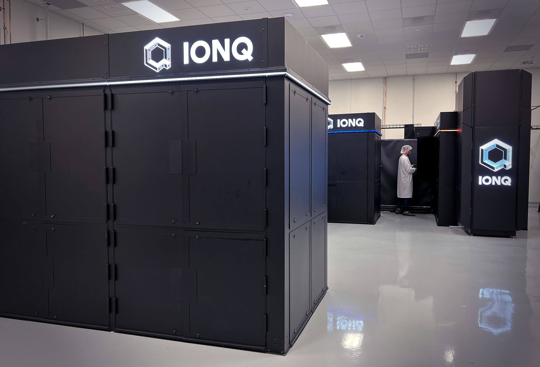 Fig. 1: Photograph of IonQ Forte (front left) in our quantum data center in College Park, MD. Copyright 2022 by IonQ