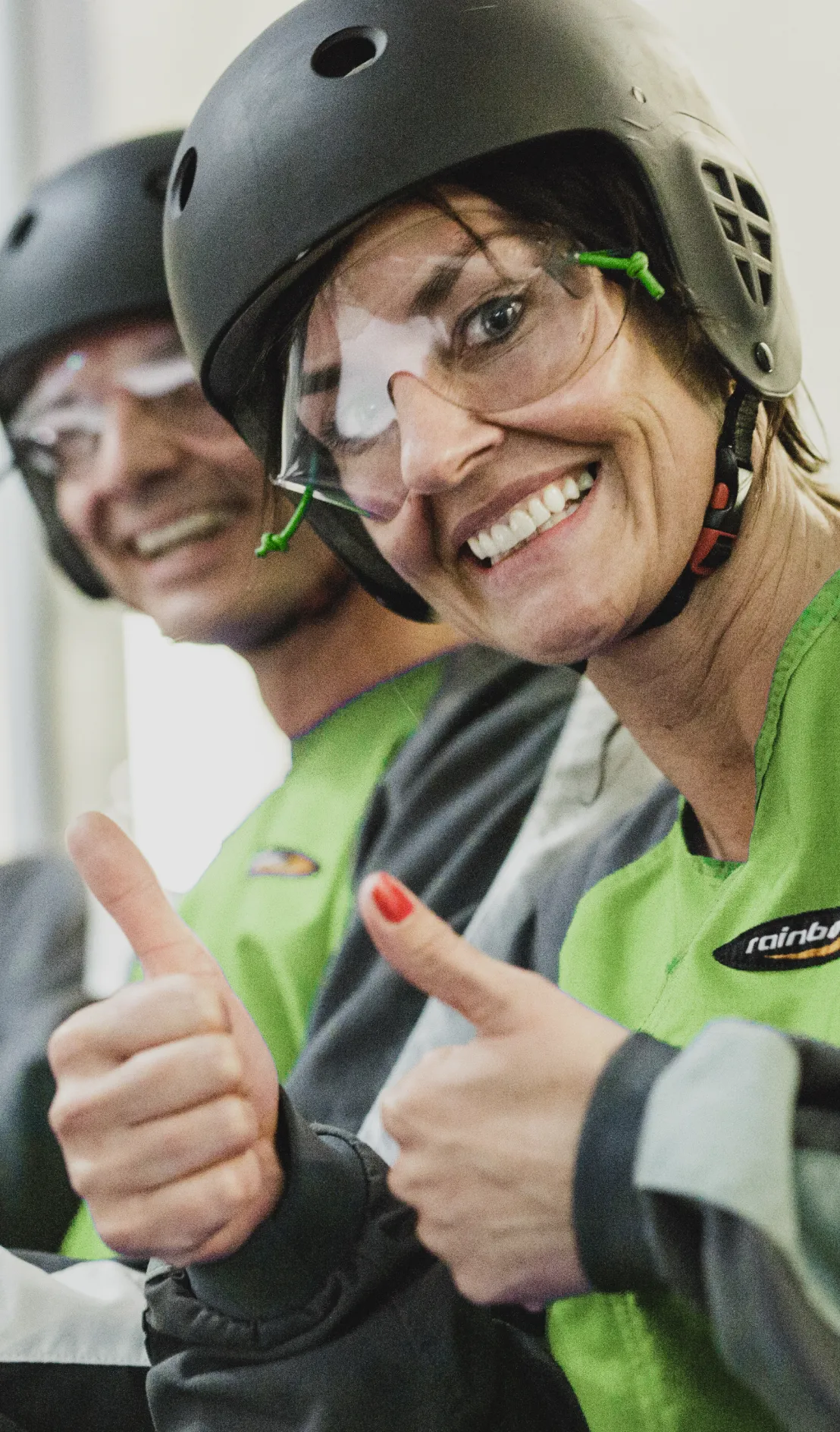 Woman in helmet giving thumbs up