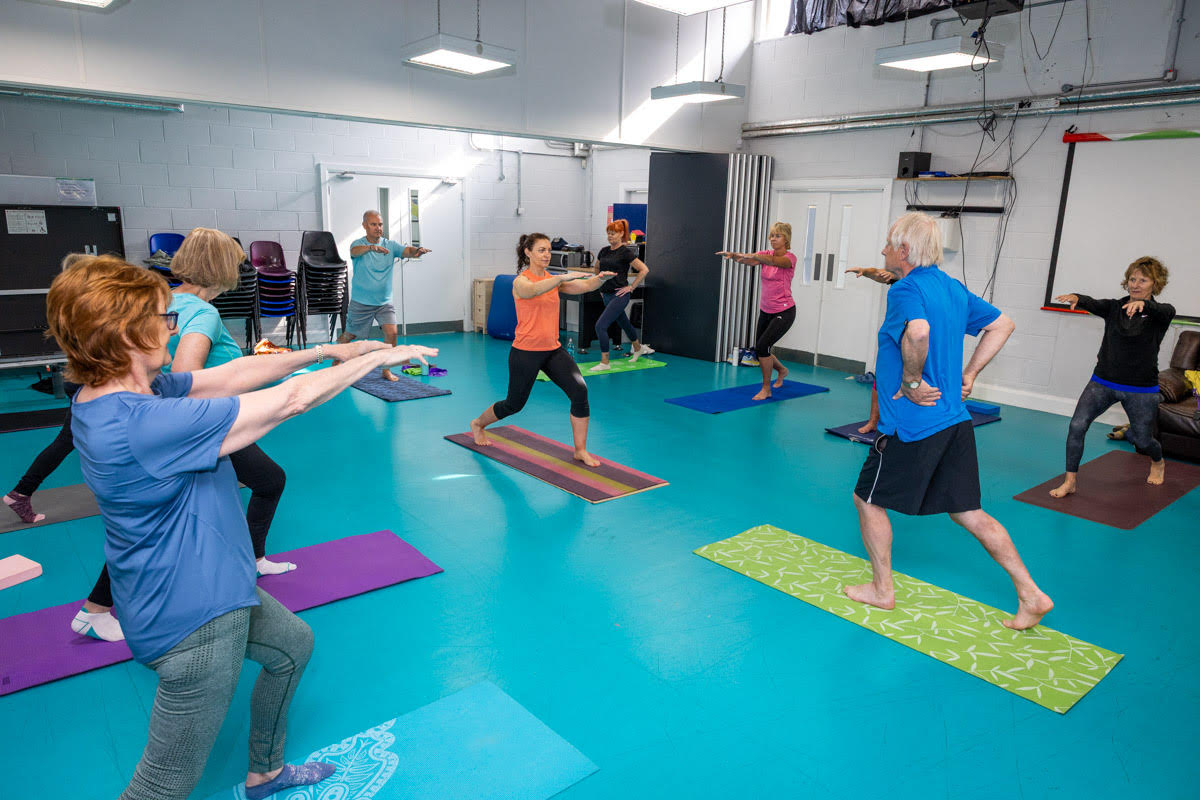 A group of people doing Pilates