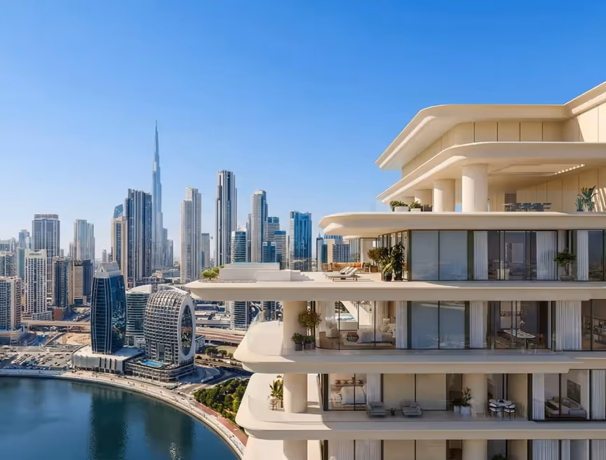 Modern multi-storey building balconies overlooking Dubai skyline with Burj Khalifa in the background and a waterfront curve.