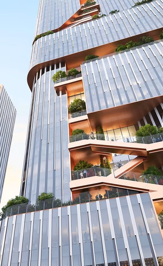 Modern high-rise building with tiered terraces featuring glass panels, greenery, and outdoor walkways.