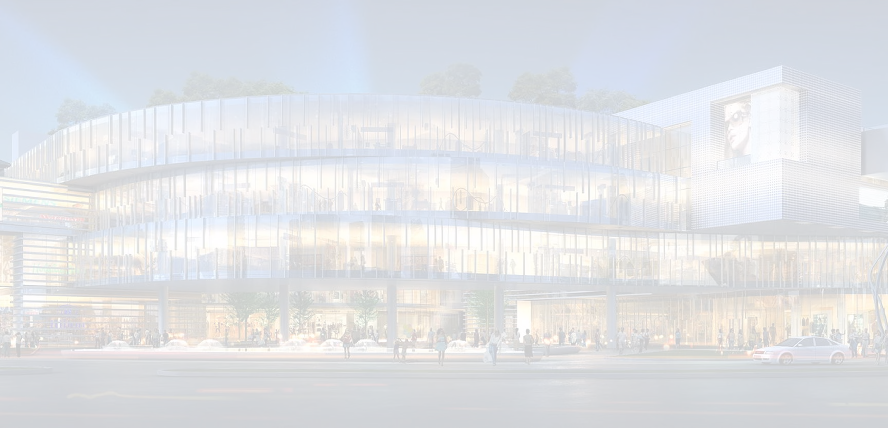 Modern multi-story glass building at night with people outside and lit interior showing a shopping mall.