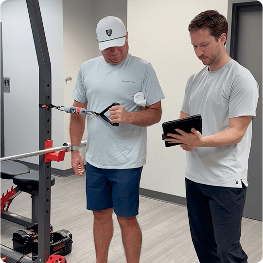 pt and client looking at tablet while using VALD equipment