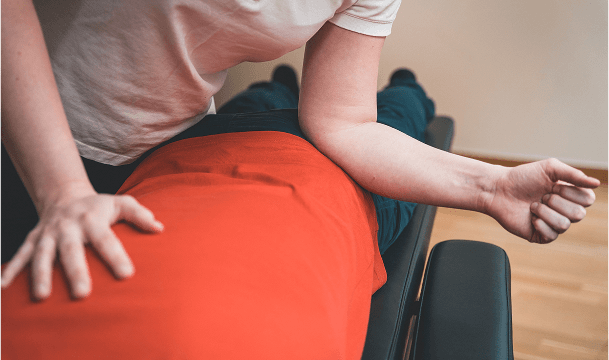 PT doing lower back massage