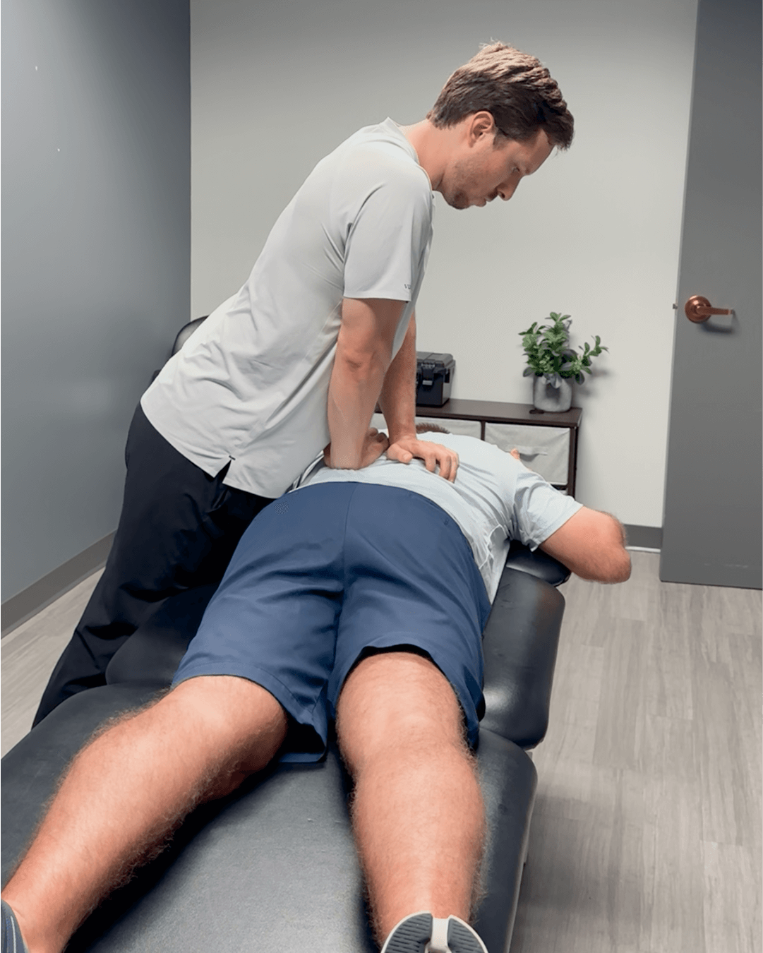 PT doing back therapy