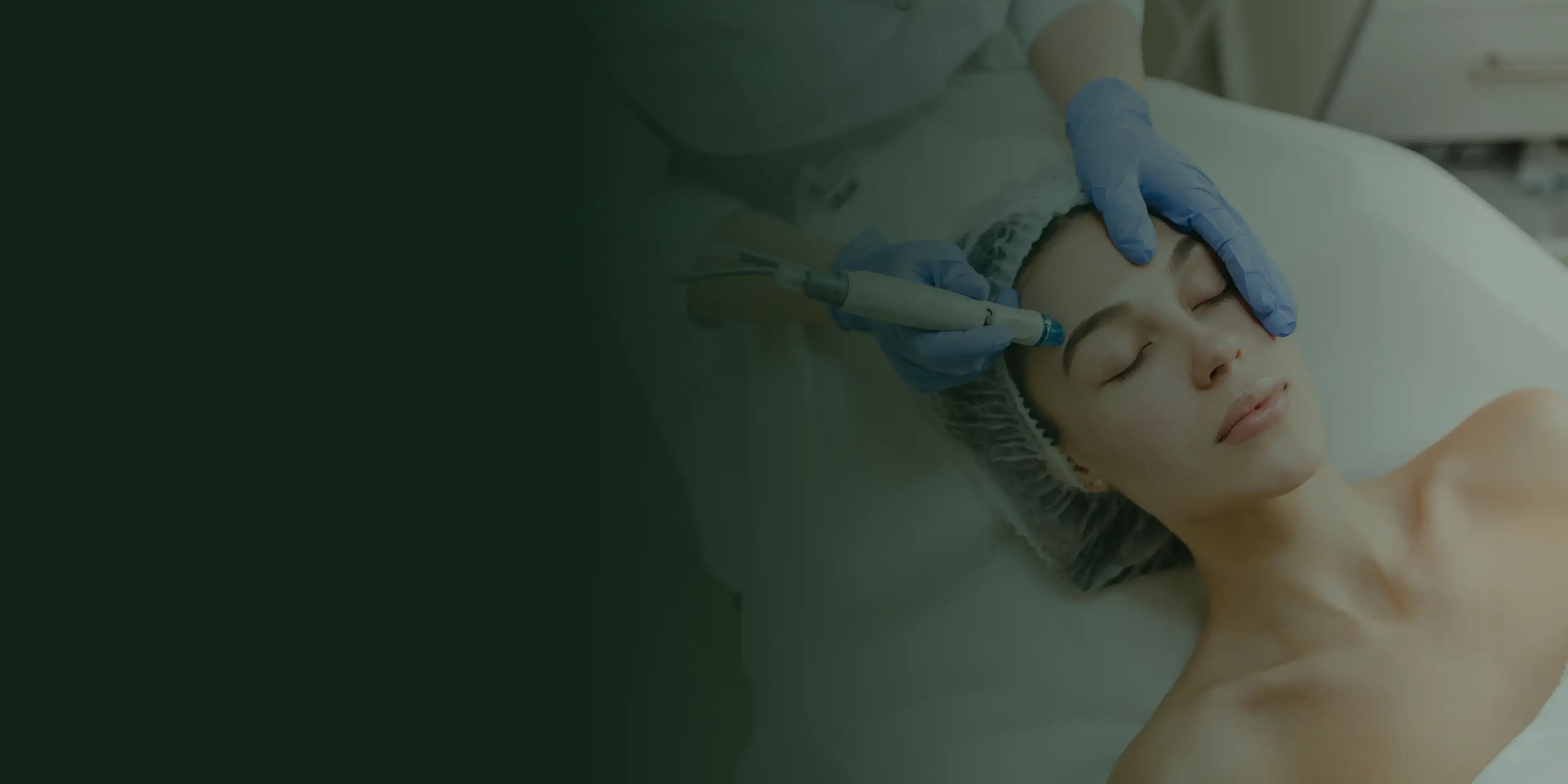 A woman with glasses touches her cheek, appearing to be in discomfort.