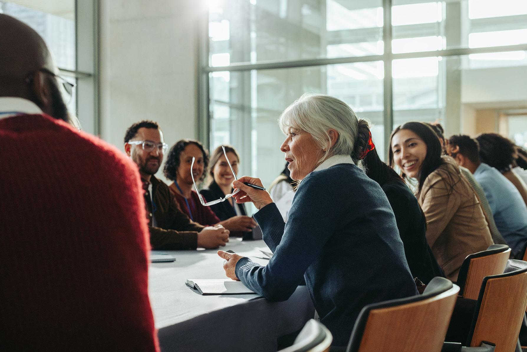 Woman leads meeting on exit planning with her team