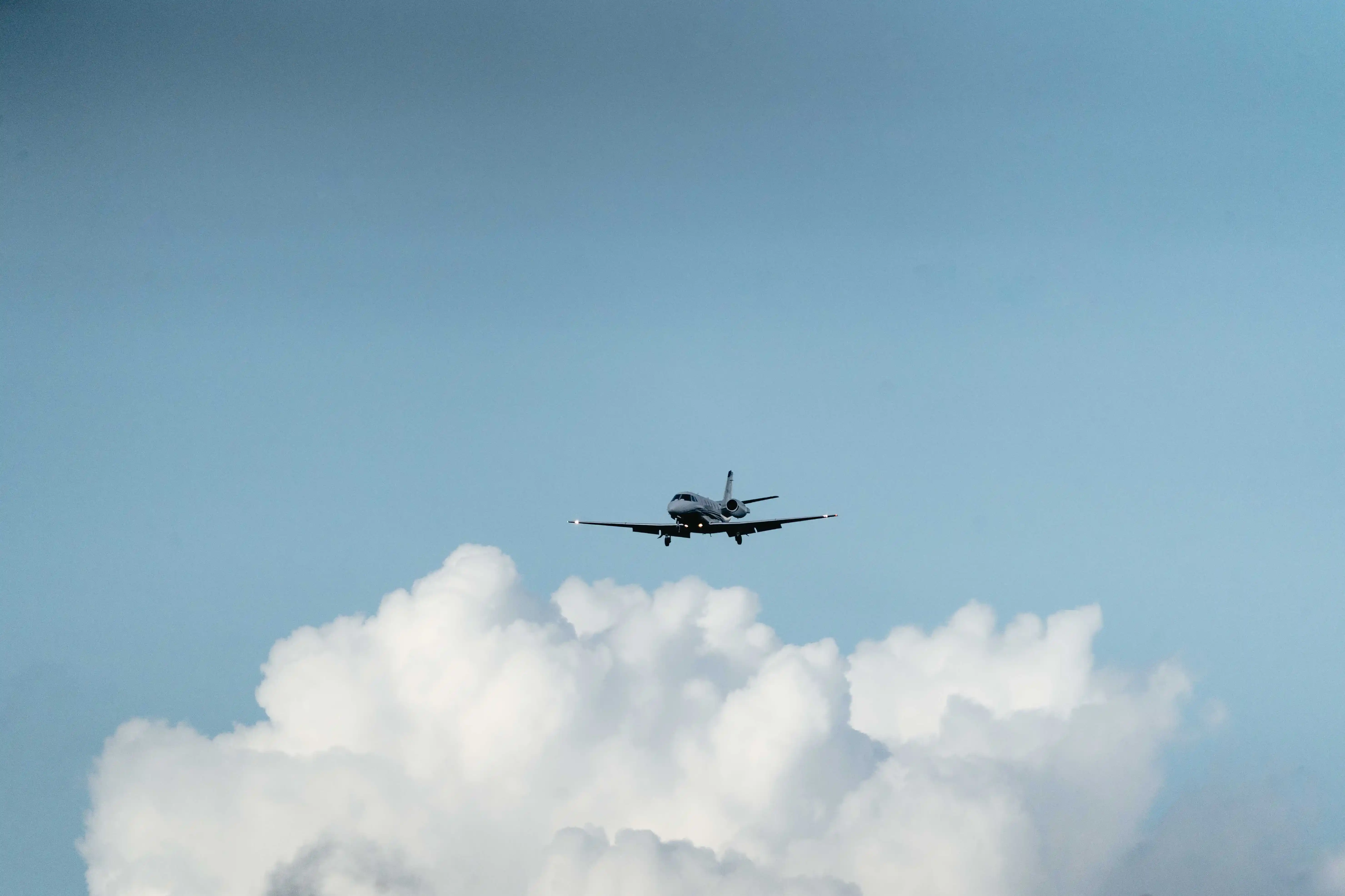 Hero Image picturing a plane in the sky