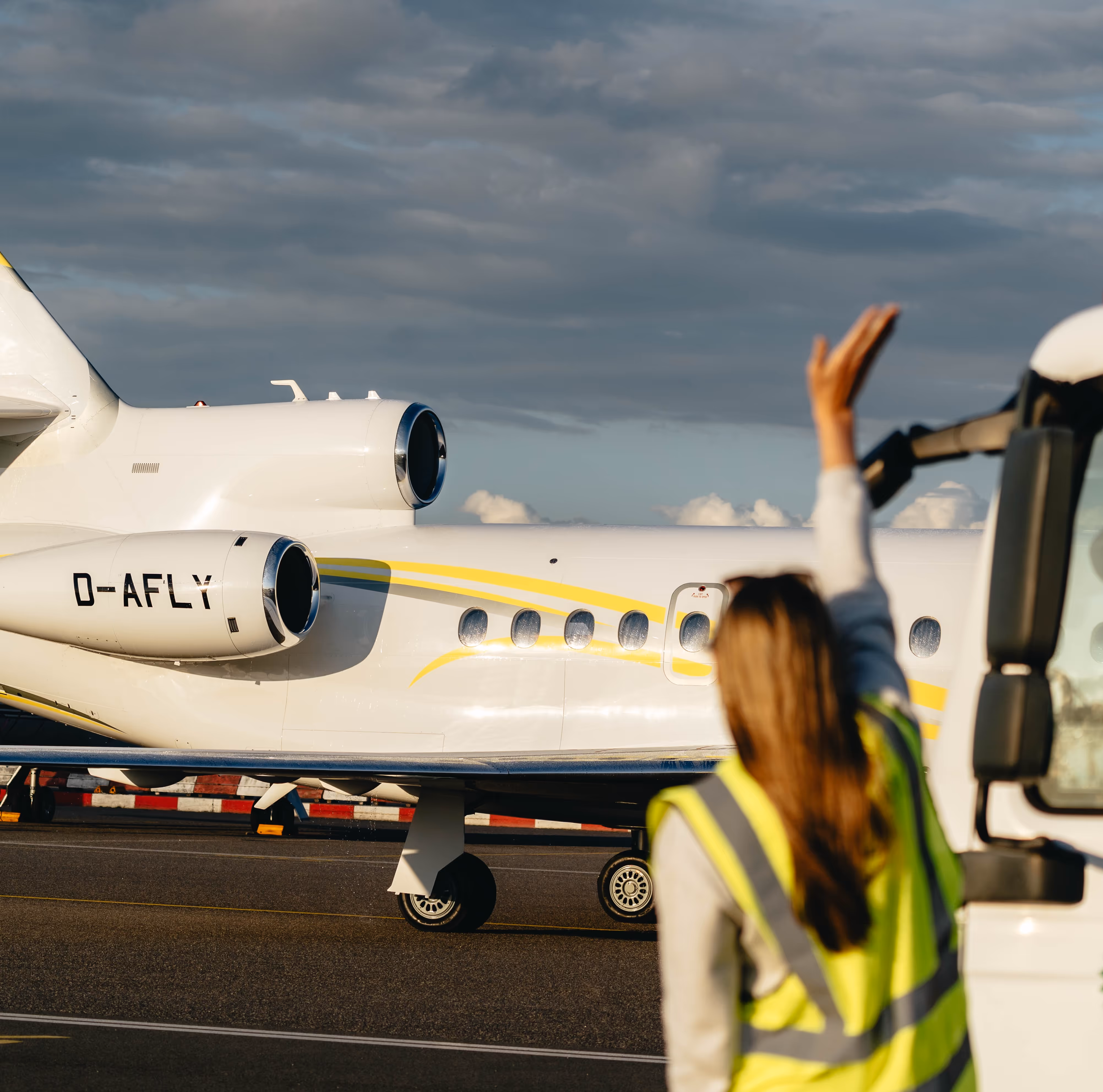 Back View of a private jet on a landing field