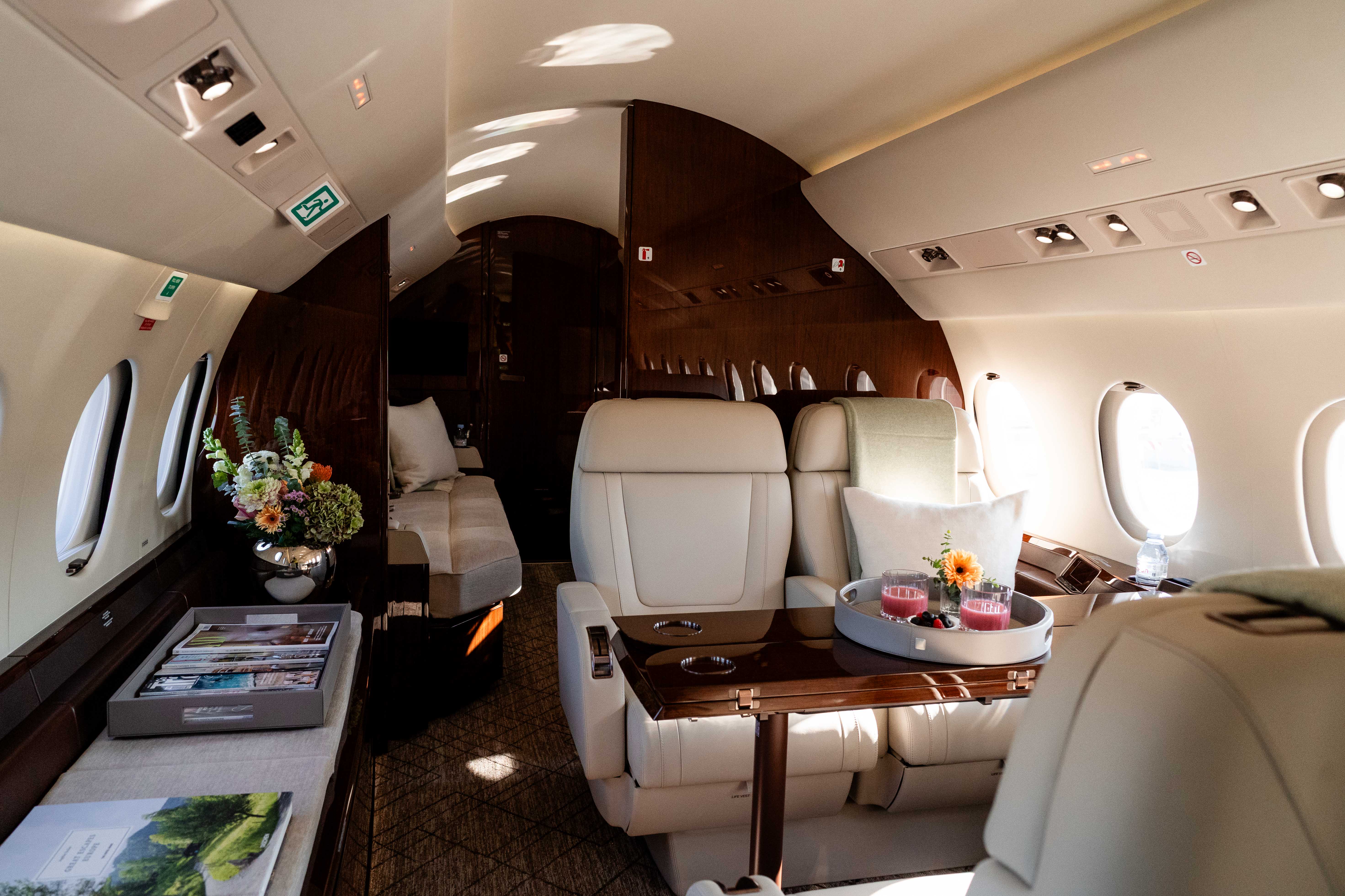 Welcome Setting with snacks and magazines on a planes seat