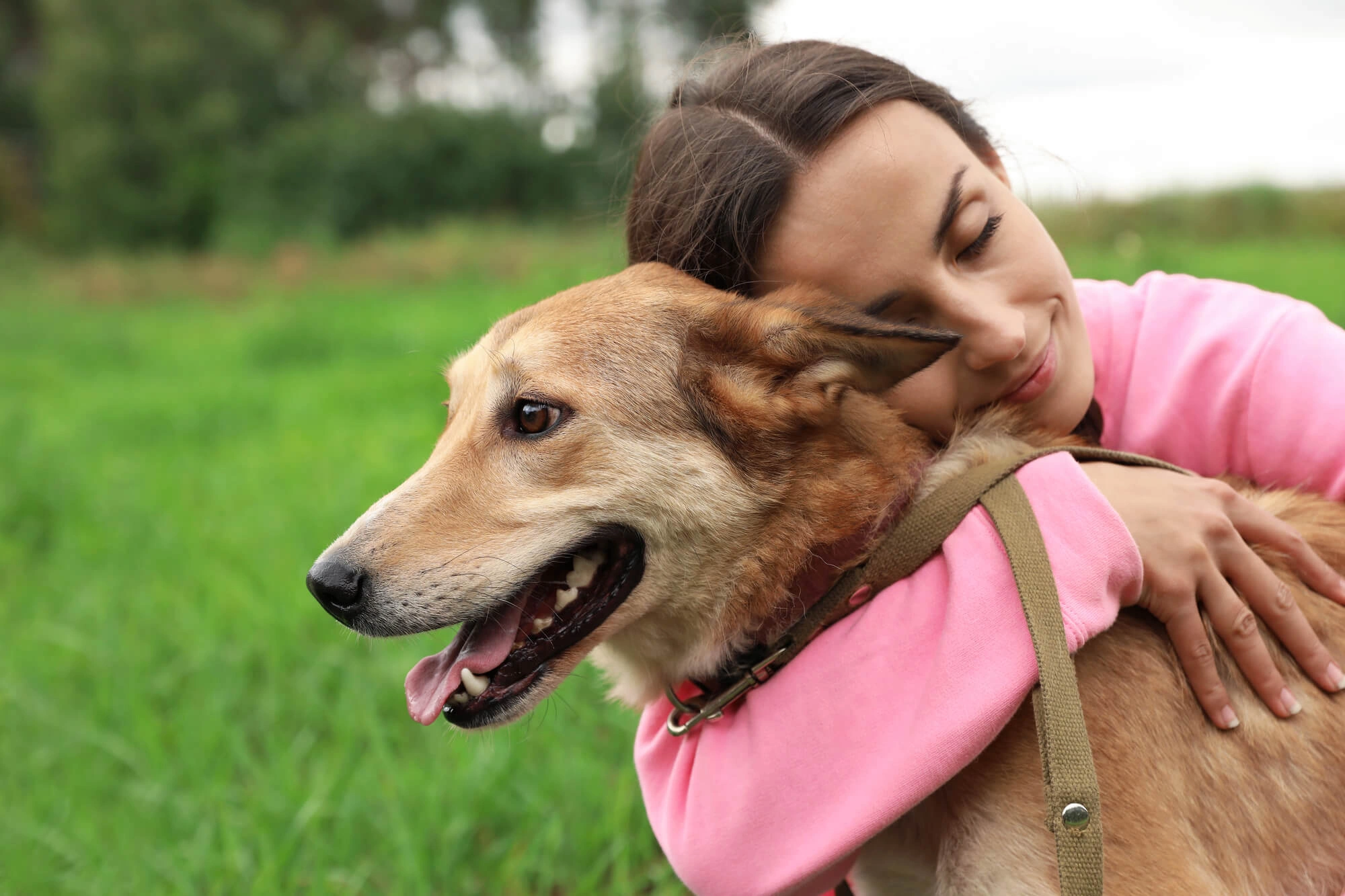 Owner hugging her dog Great Falls Veterinary Services