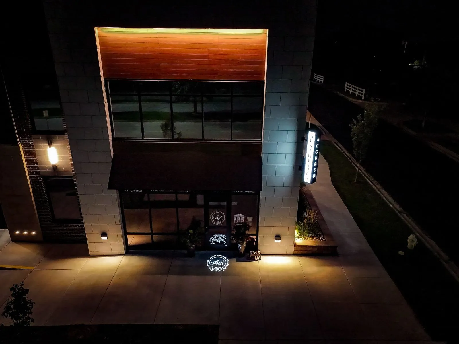 Drone shot of Accurso Aesthetics, Medical Spa Lee's Summit, at Night