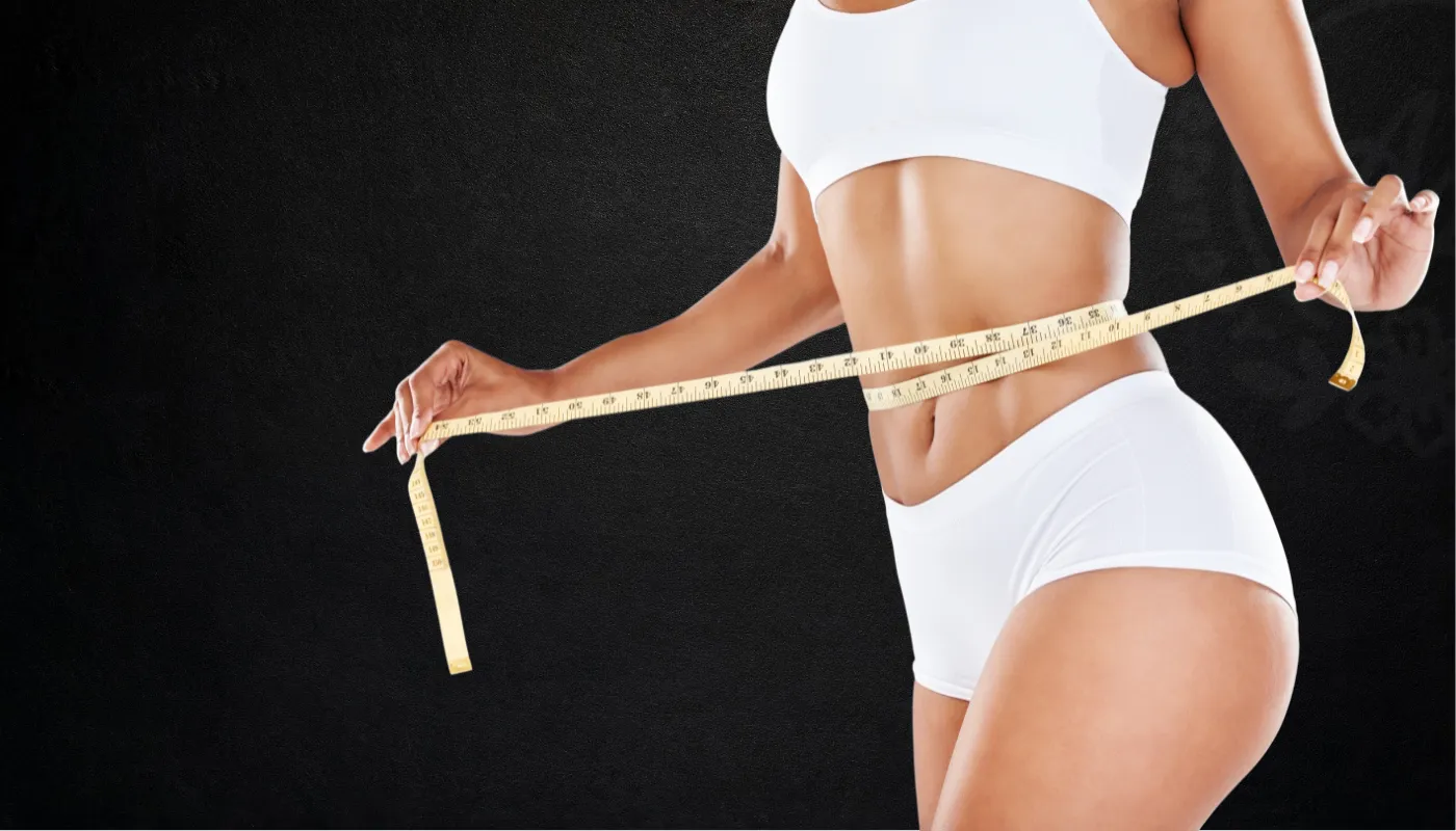 Woman measuring her waist