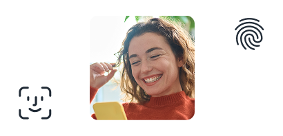 A person using their phone, smiling, surrounded by the biometric login logos