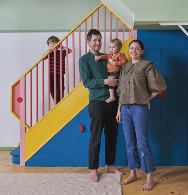 Photo of the owners with their kids, stood by the new staircase. By Office S&M, RIBA Chartered Architectural Practice in London.