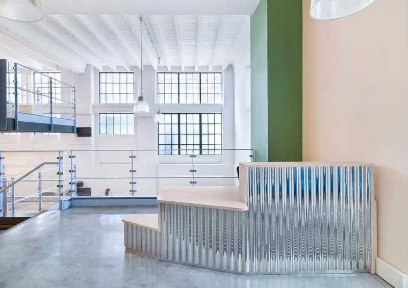 Interior photo of the Commercial project, showing a workspace fitout in blue and green tones