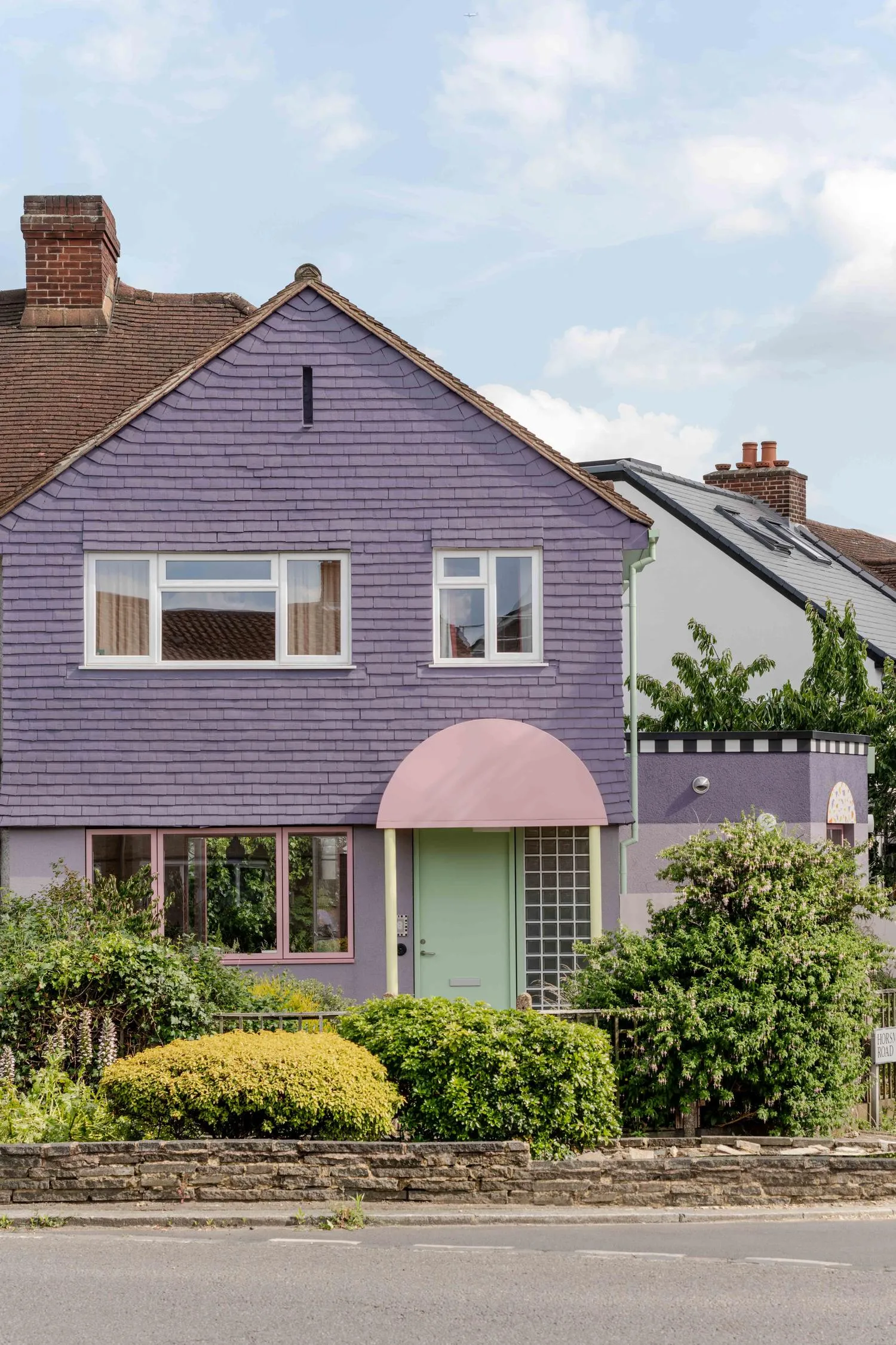 External photo of Brockley House, looking at the facade and the entrance directly from a close distance. By Office S&M, RIBA Chartered Architectural Practice in London.