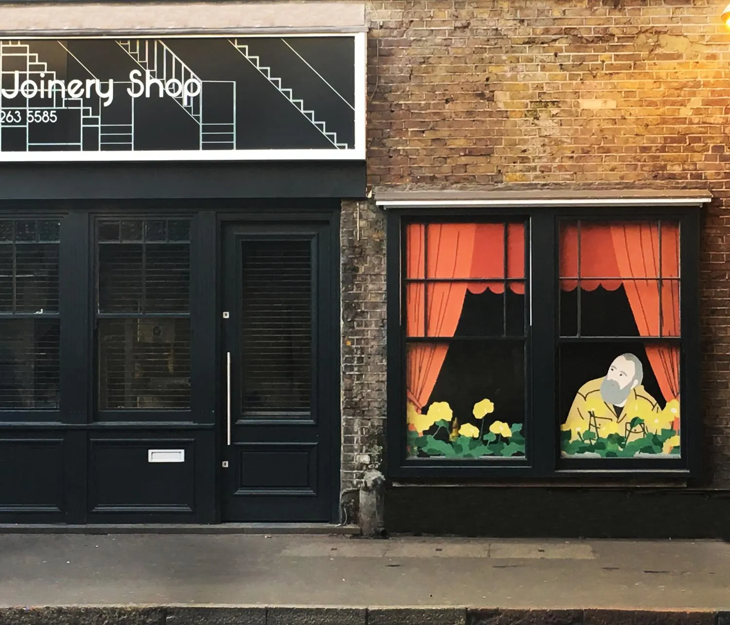 Elevation photo showing the joinery shop and its window display. By Office S&M, RIBA Chartered Architectural Practice in London.