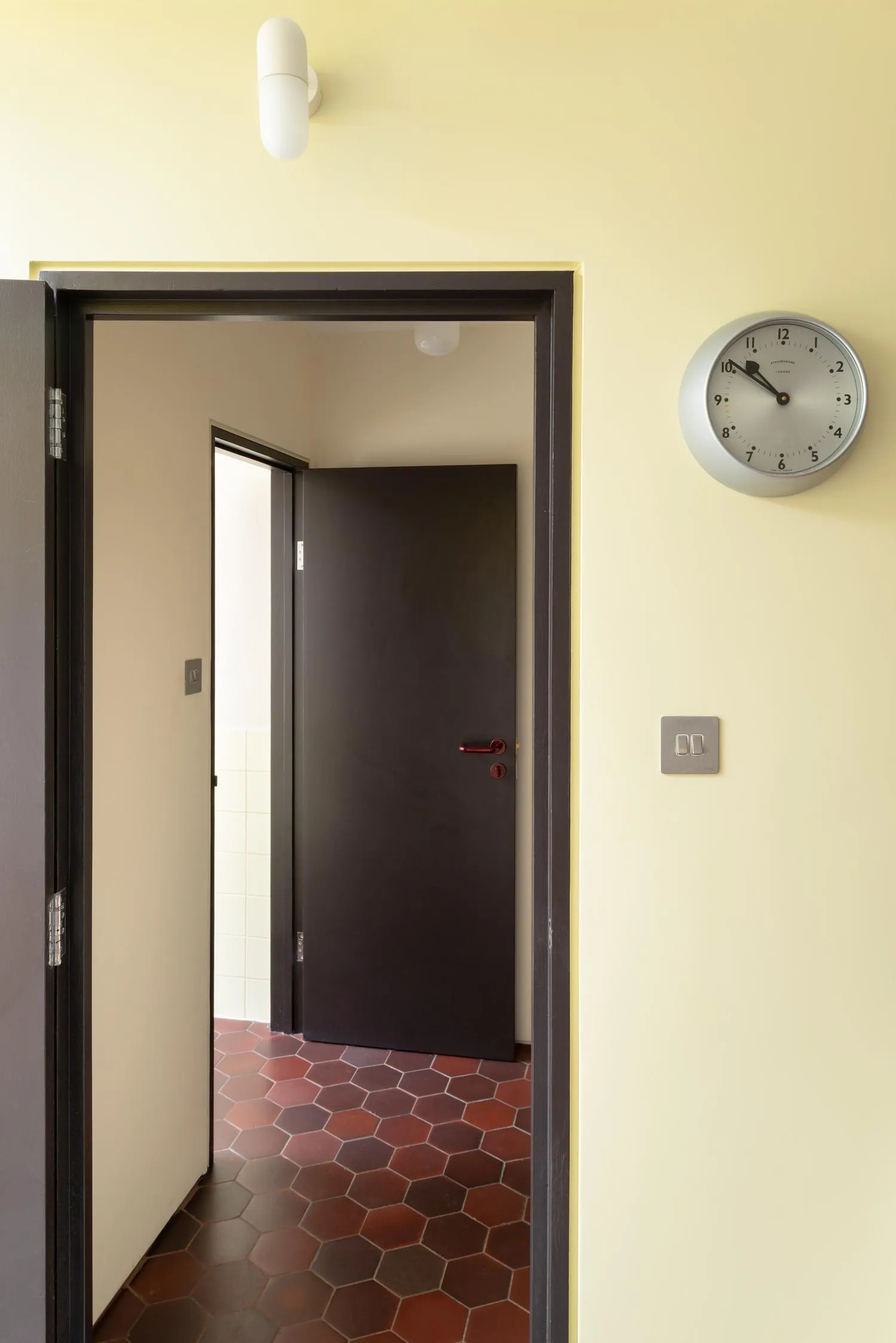 Bathroom entrance with new floor tiles. By Office S&M, RIBA Chartered Architectural Practice in London.