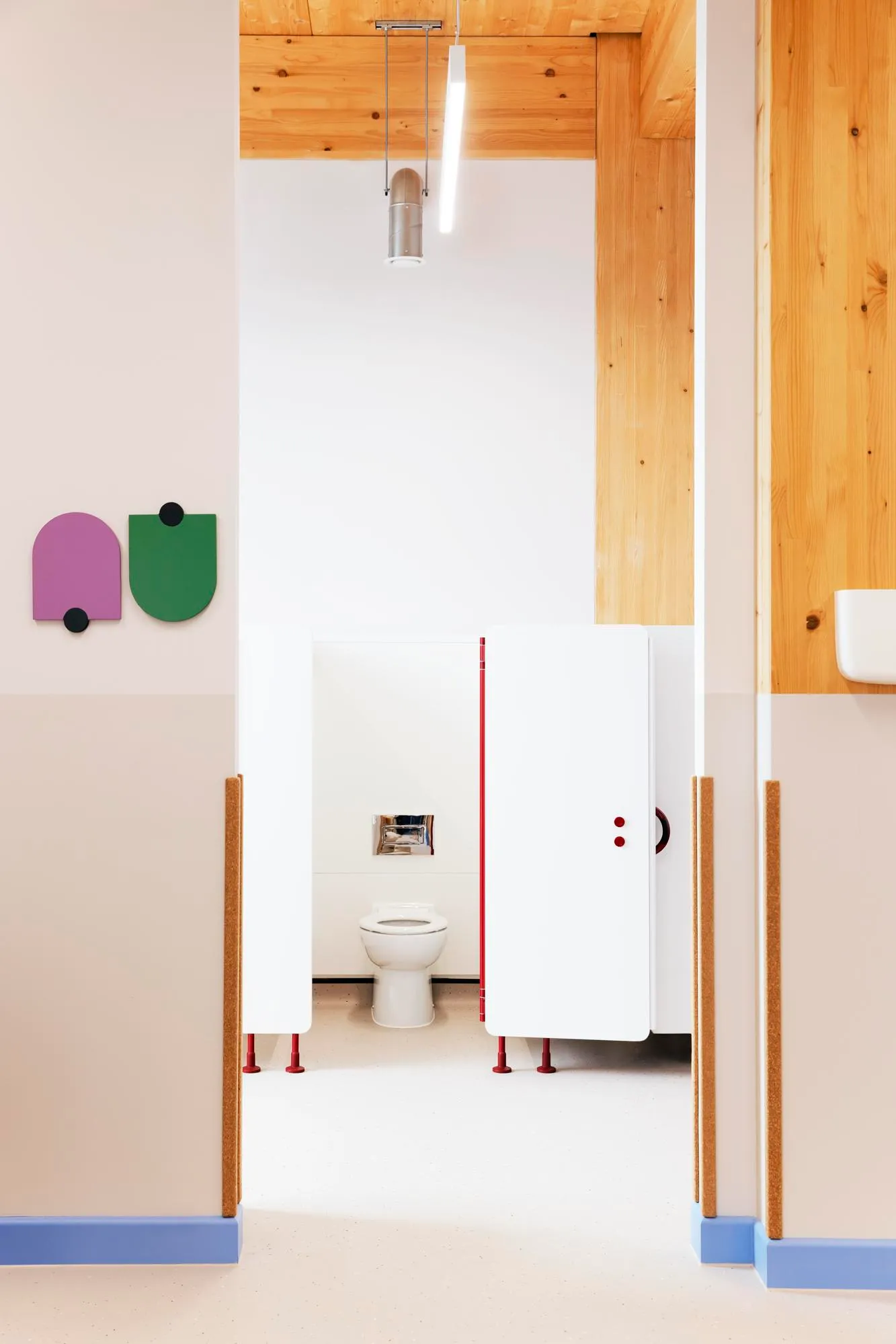 Photo of the bathroom stalls from the corridor. By Office S&M, RIBA Chartered Architectural Practice in London.